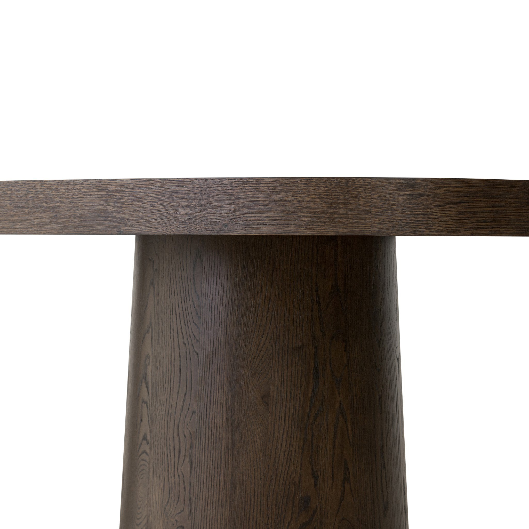 Close up of a wooden dining table with two cylindrical legs on a white background.