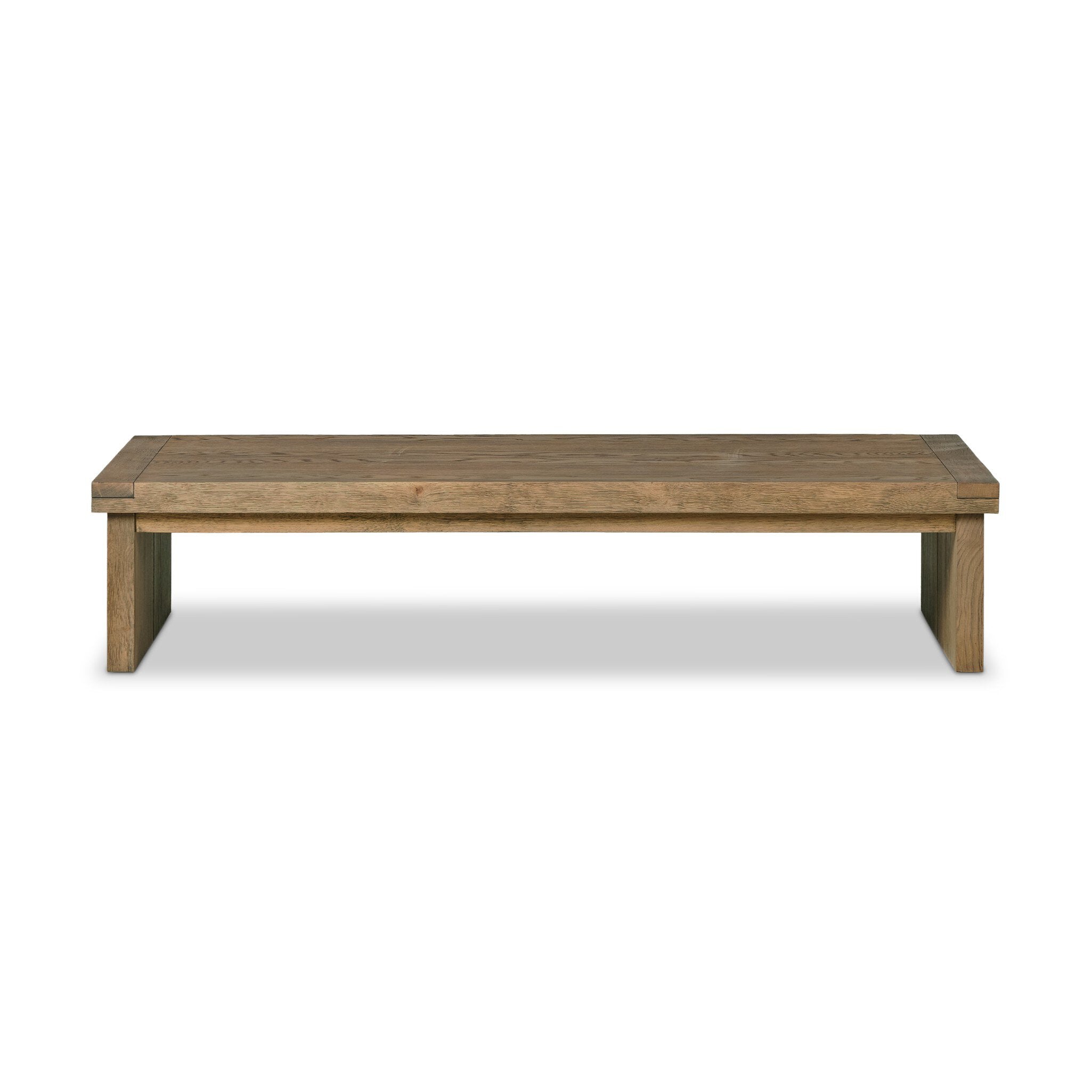 An oak coffee table on a white background.| Wildwood Home Co.