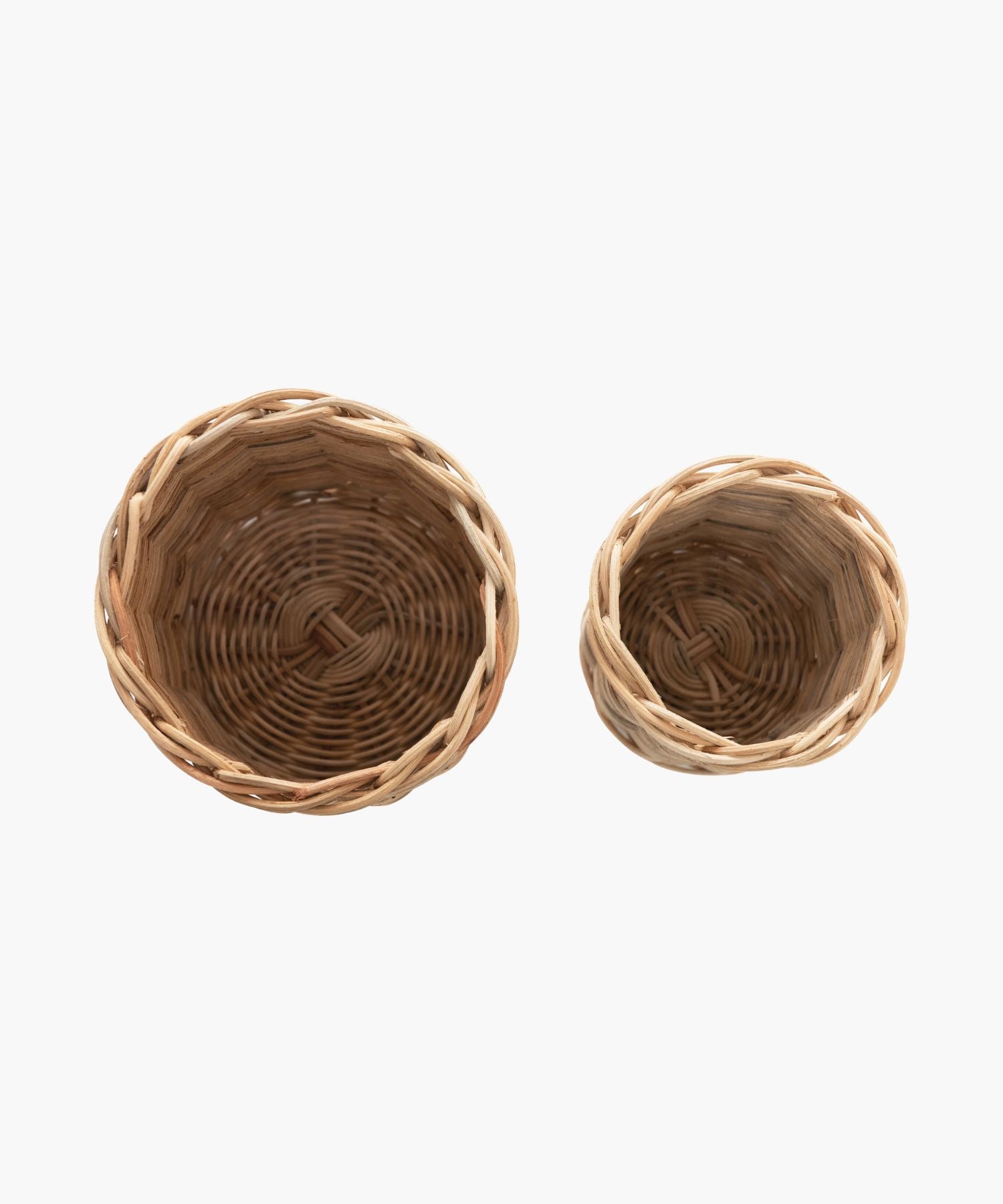 Overhead view of the hand woven wicker basket container in 2 sizes. Both have a natural, woven texture, evoking a rustic, cozy feel.
