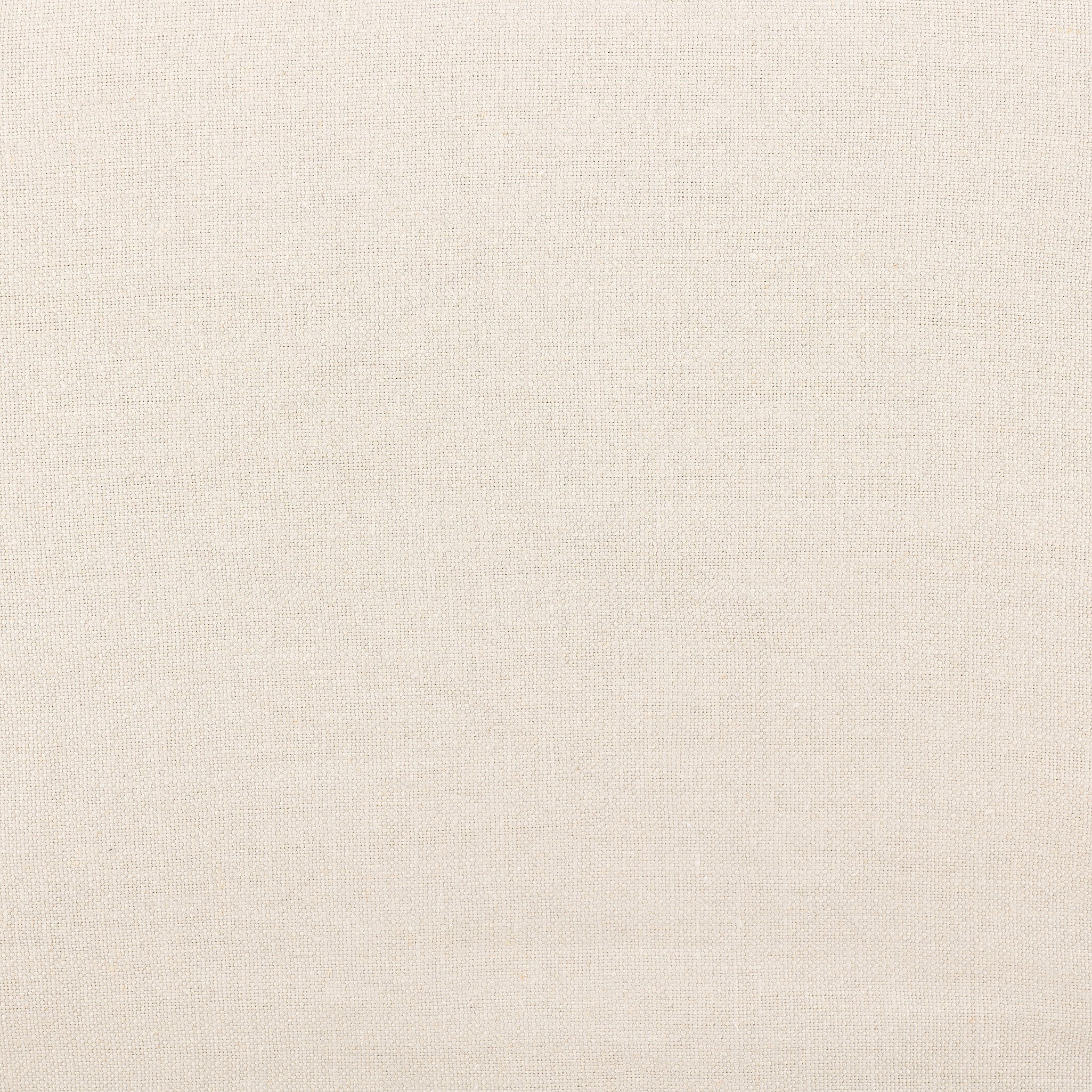 Close up of an ivory wide arm slipcover accent bench on a white background.