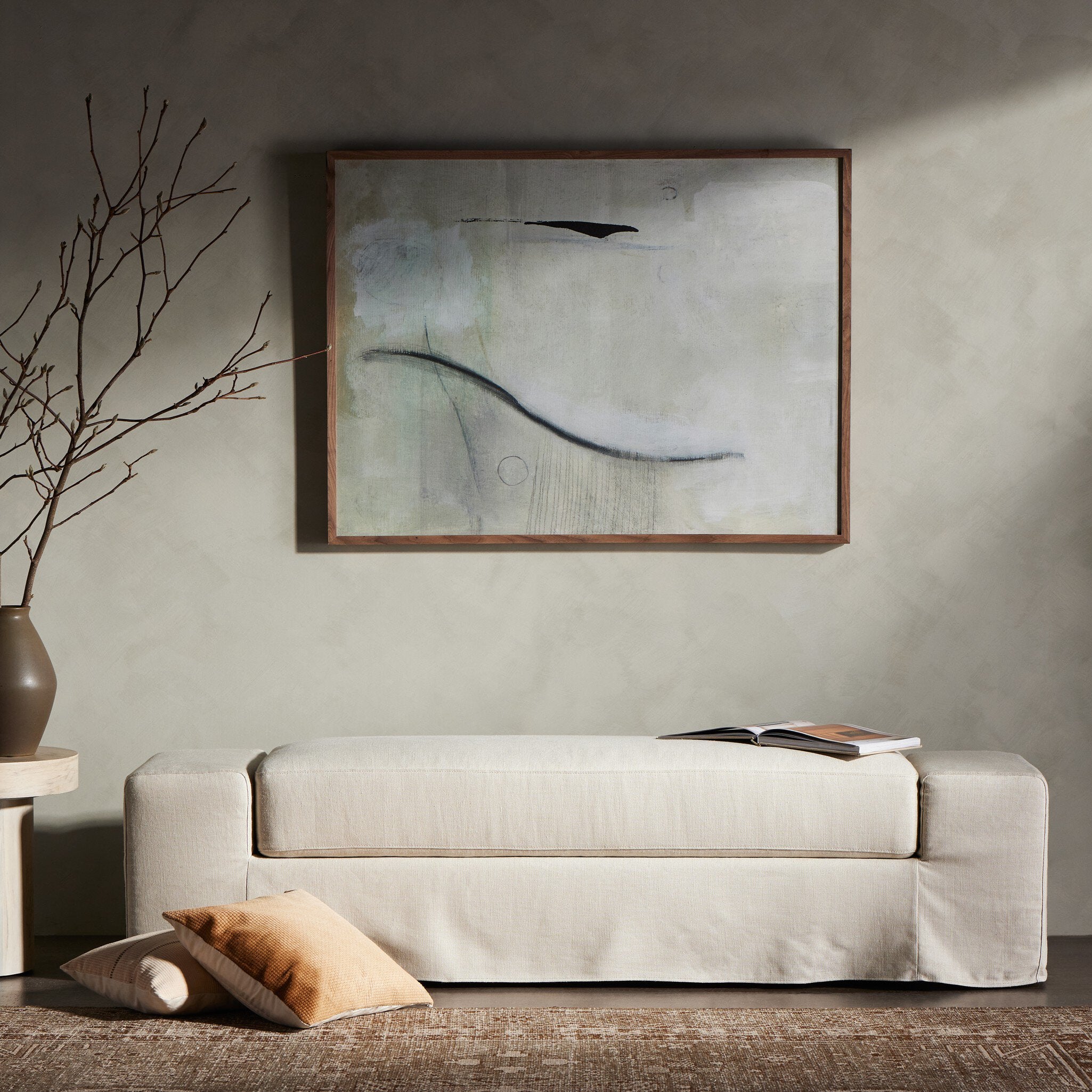 Ivory accent bench with a vase and abstract painting in a room setting. | Wildwood Home Co.