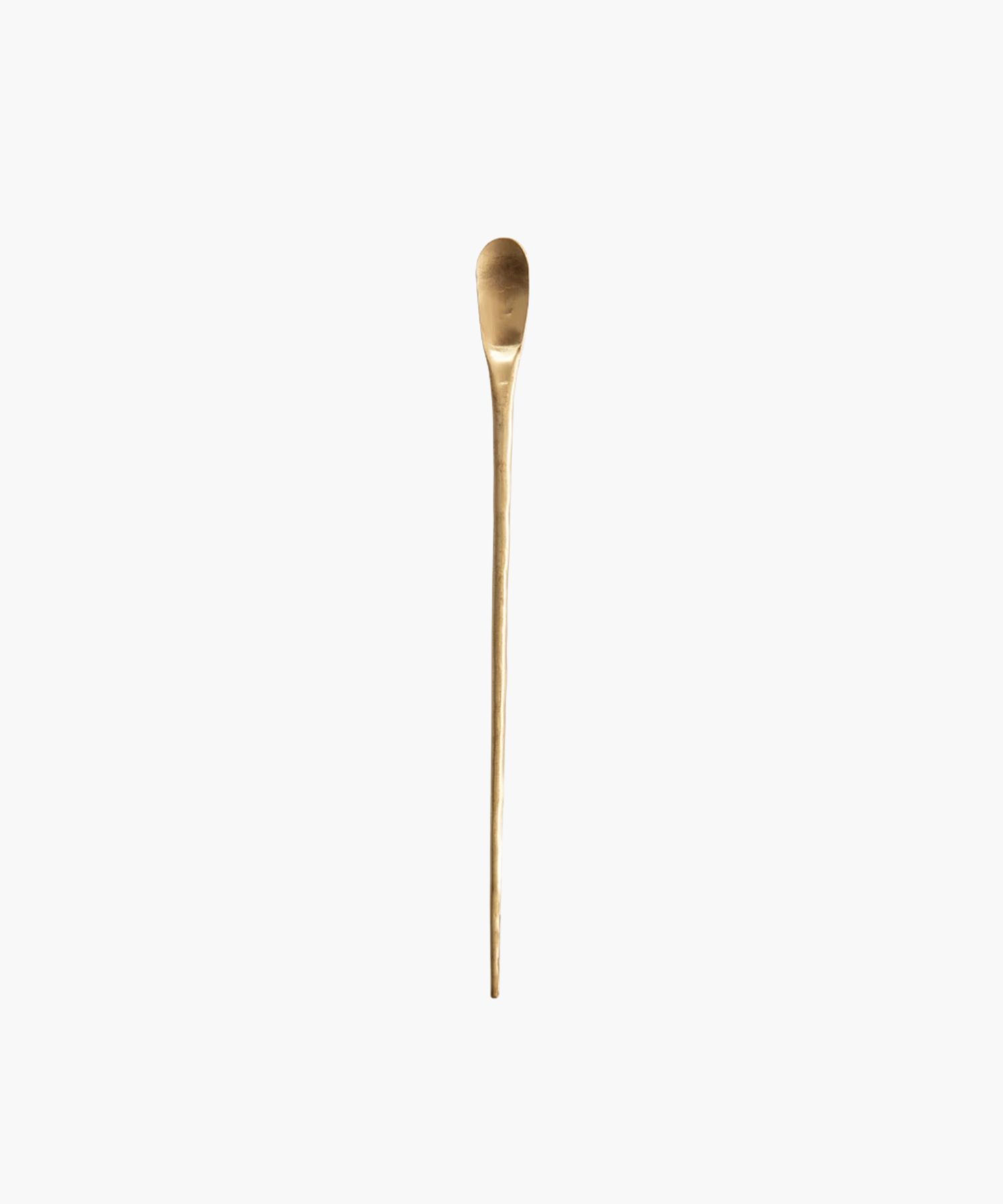 A long, elegant brass cocktail spoon with a smooth, rounded head and slender handle. It has a simplistic design and a polished, golden finish on a white background. | Wildwood Home Co.