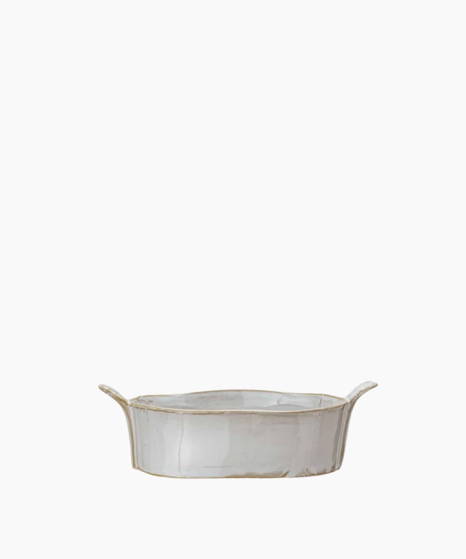 A mini oval white ceramic stoneware baker with slightly raised, flared handles on each end. The baker has a glossy finish, conveying a minimalist, elegant design.