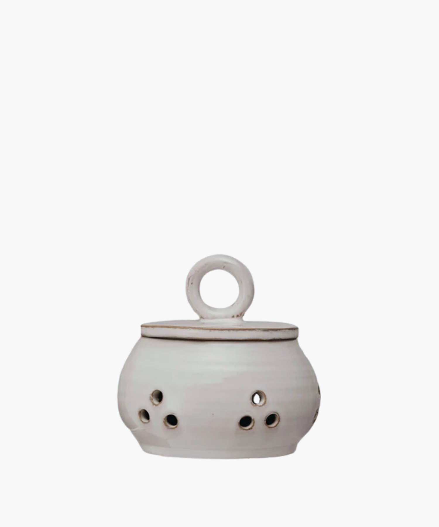 Ceramic garlic or onion keeper with a lid and circular handle, featuring small circular cutouts on the body. The pot has a rustic, handcrafted appearance. | Wildwood Home Co.