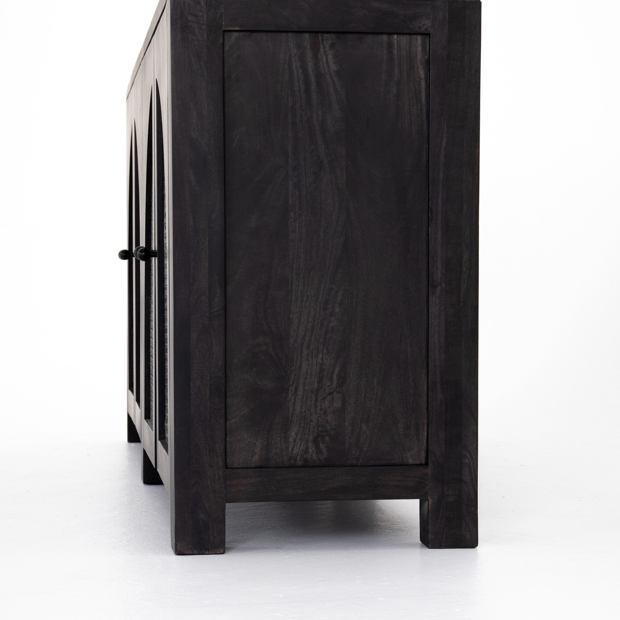 Black-washed mango sideboard with arched cane door panels and black hardware on a white background.
