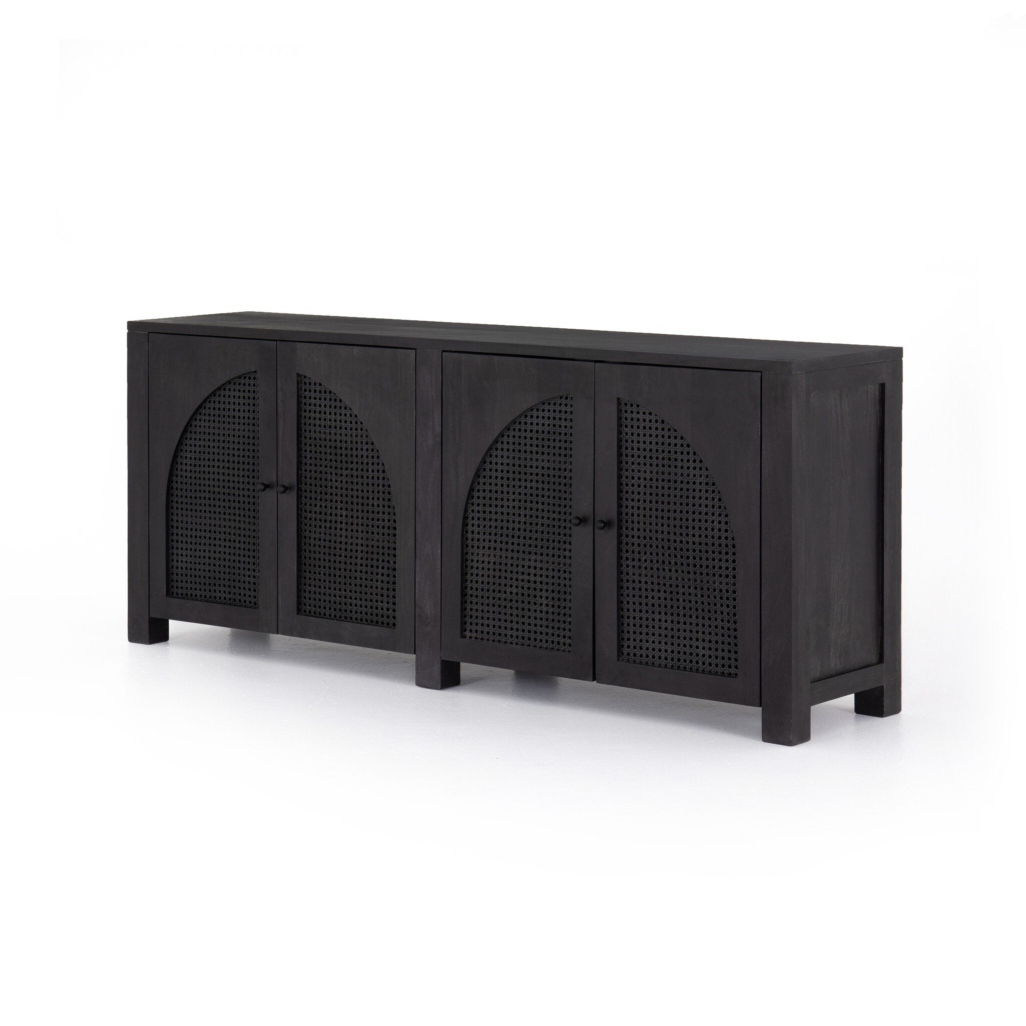 Black-washed mango sideboard with arched cane door panels and black hardware on a white background. | Wildwood Home Co