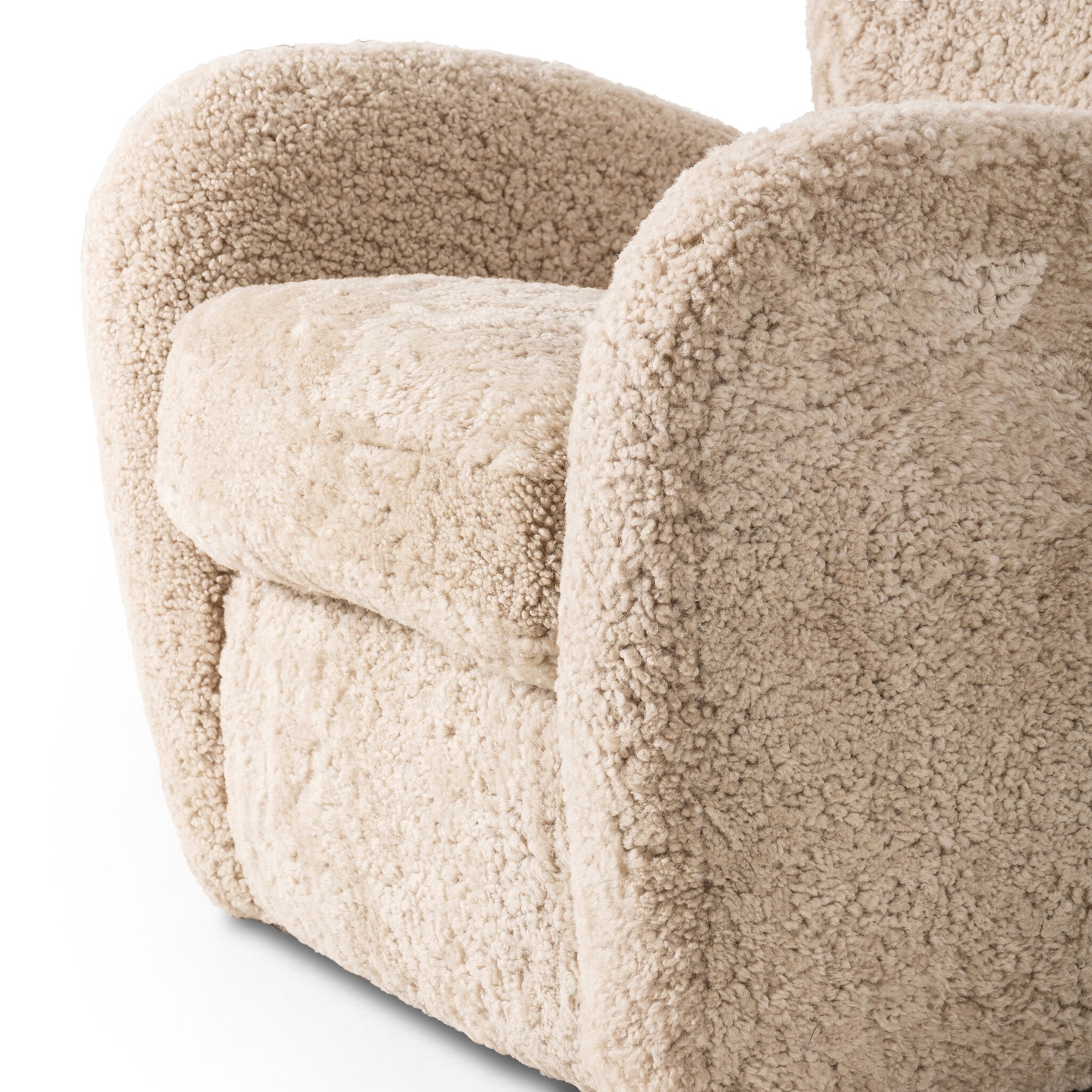 Close-up of a textured beige armchair on a white background