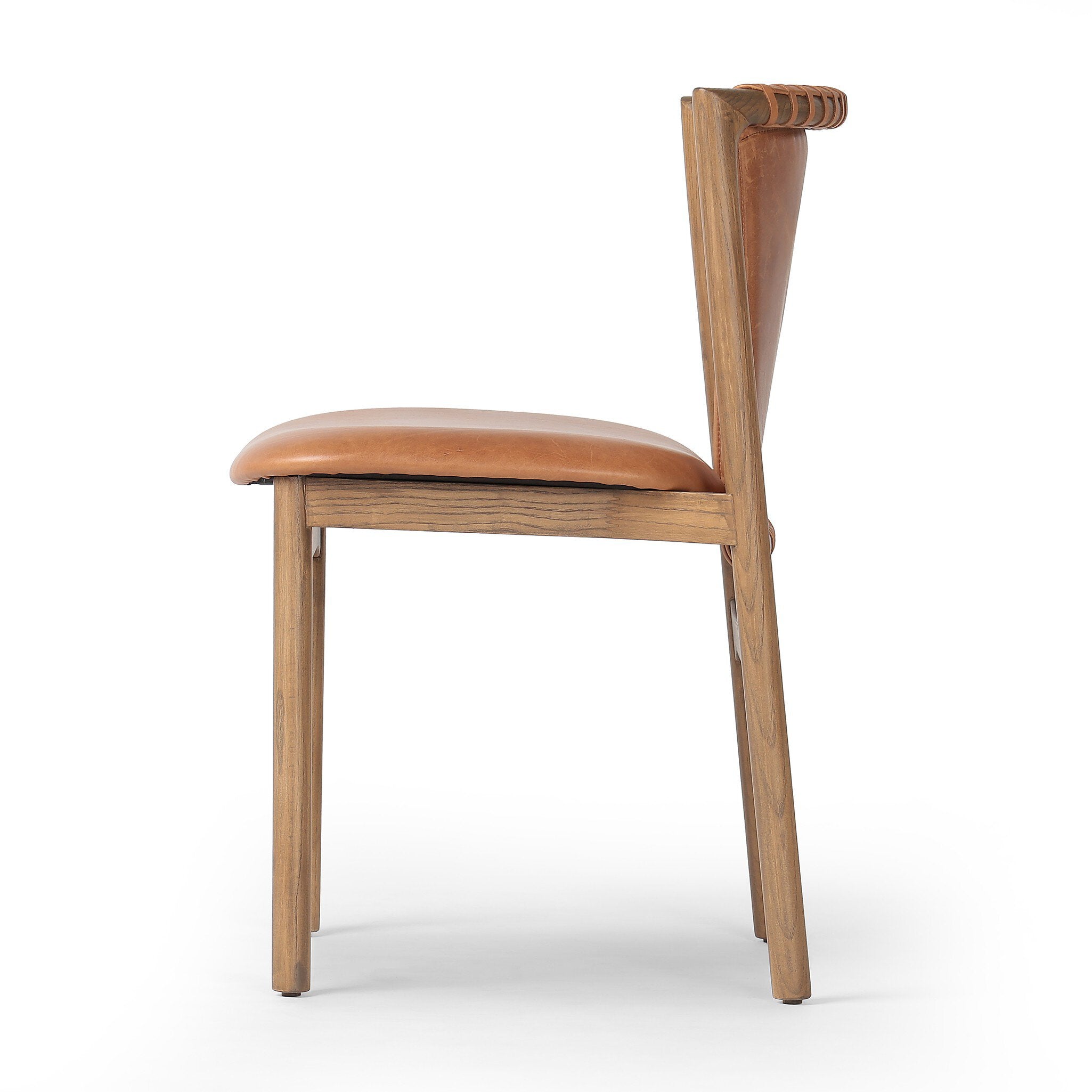 Side profile of a tobacco-grain leather chair with leather wrap detailing on a wooden frame on a white background.