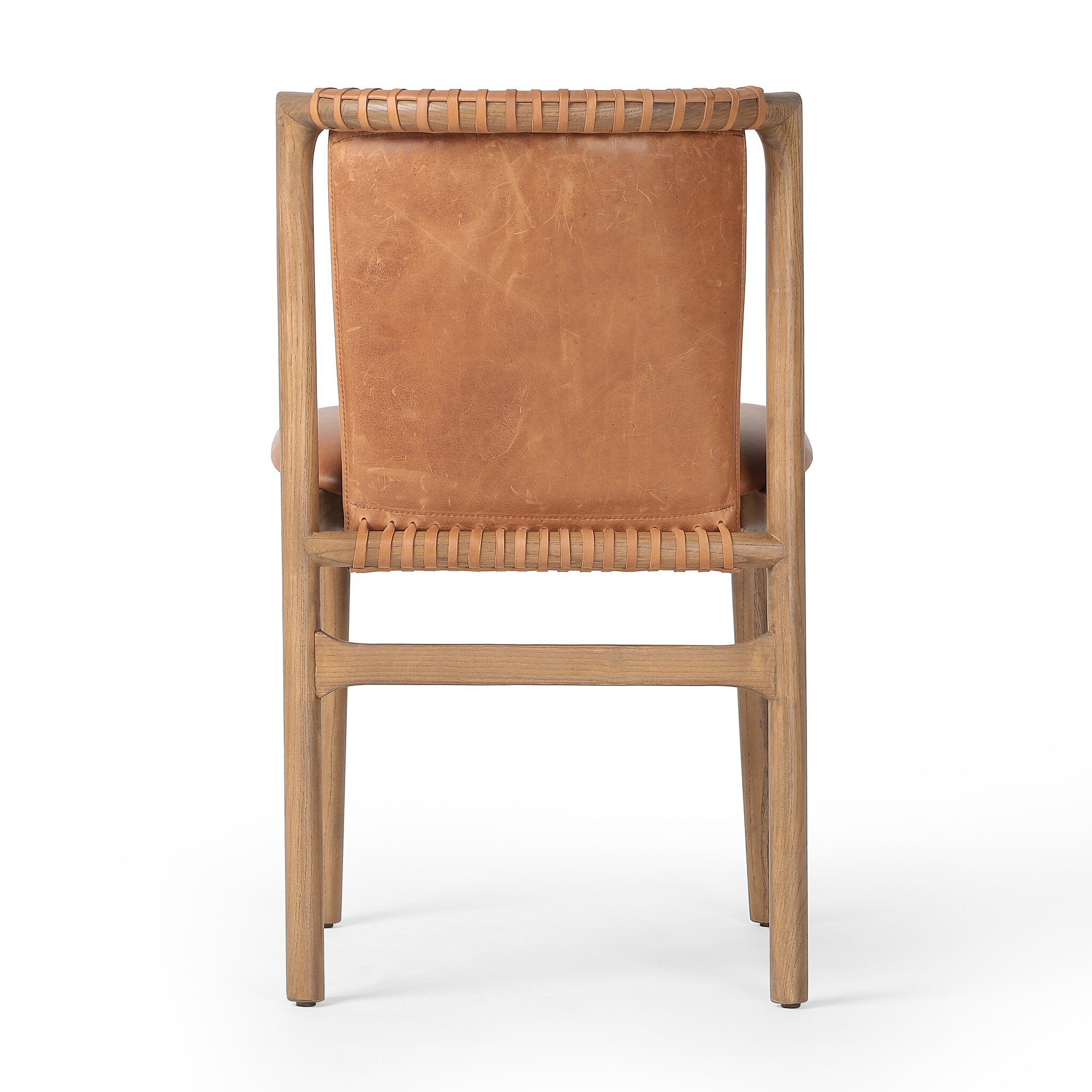 The back of a tobacco-grain leather chair with leather wrap detailing on a wooden frame on a white background.