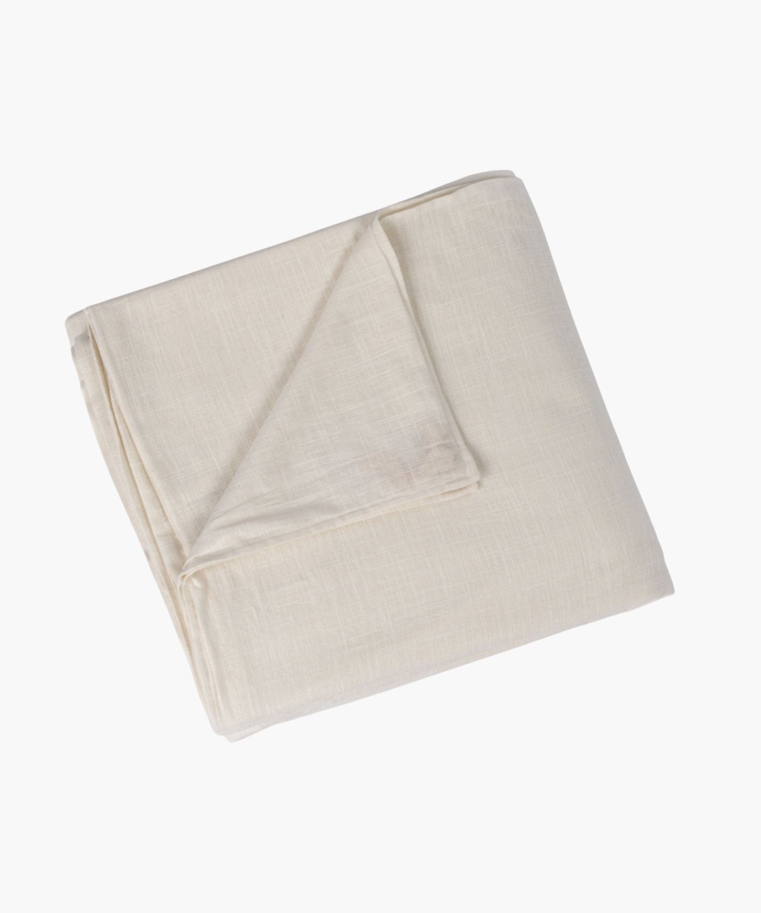 Beige blanket folded on a white background. | Wildwood Home Co.