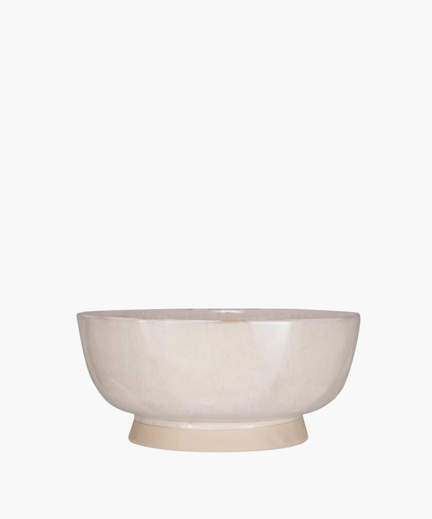 A simple, round, beige ceramic bowl with a glossy finish, set against a white background. The bowl's minimalist design conveys a sense of elegance. | Wildwood Home Co.