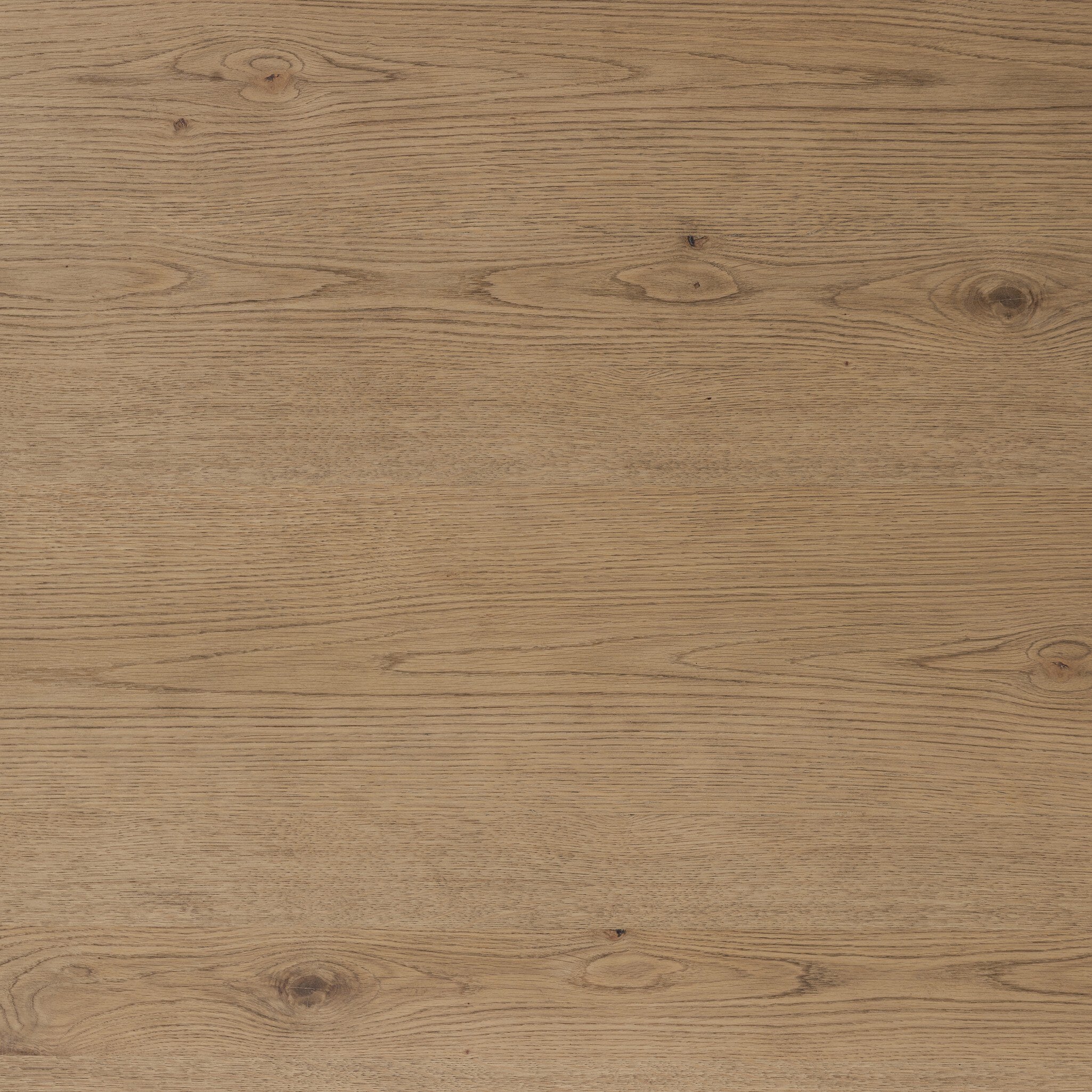 Close up of the dining table showing its color and wood grain. 