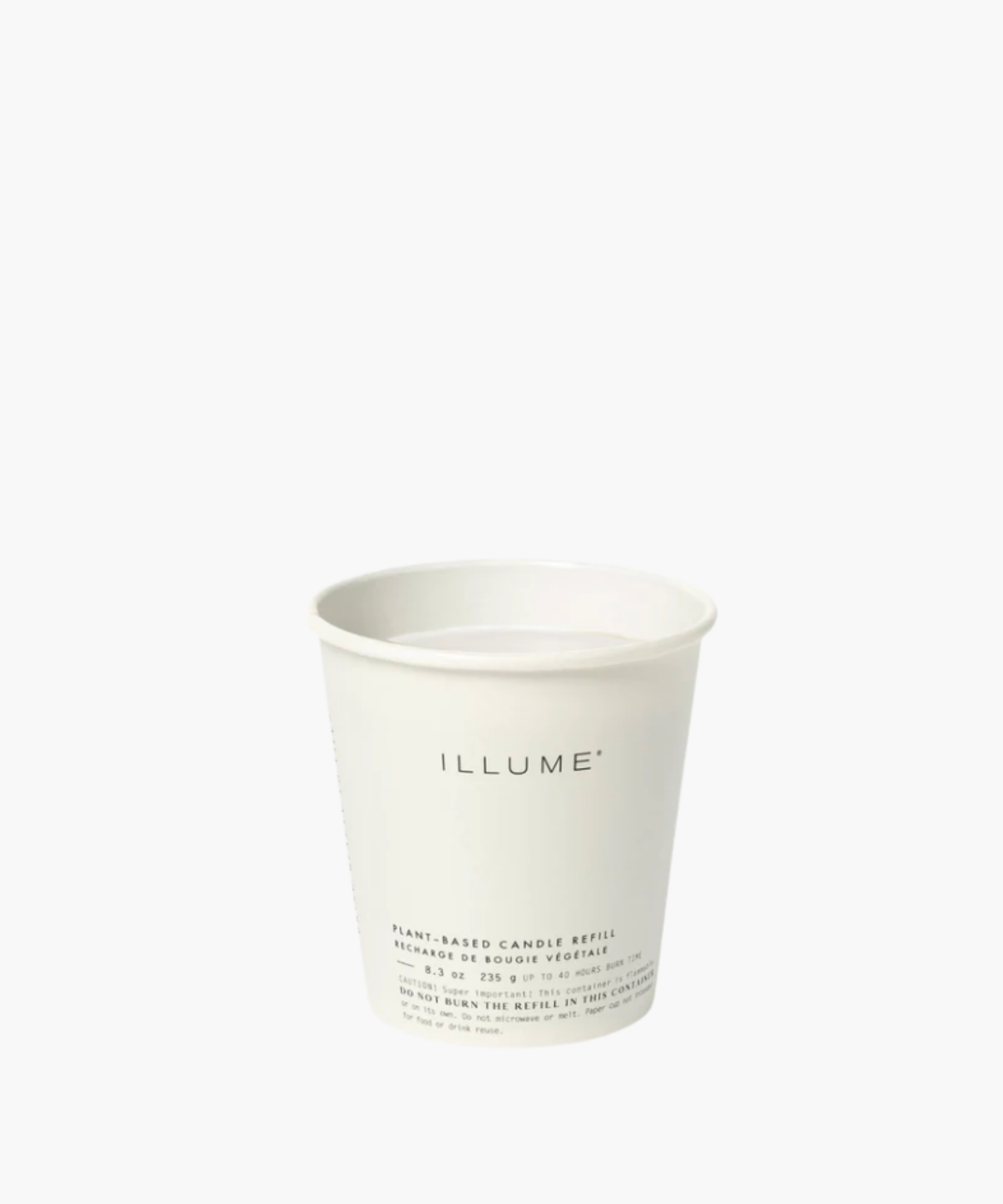 White paper cup with "ILLUME" printed in minimalist font. Labeled as a plant-based candle refill, conveying simplicity and eco-friendliness. Text details usage precautions.