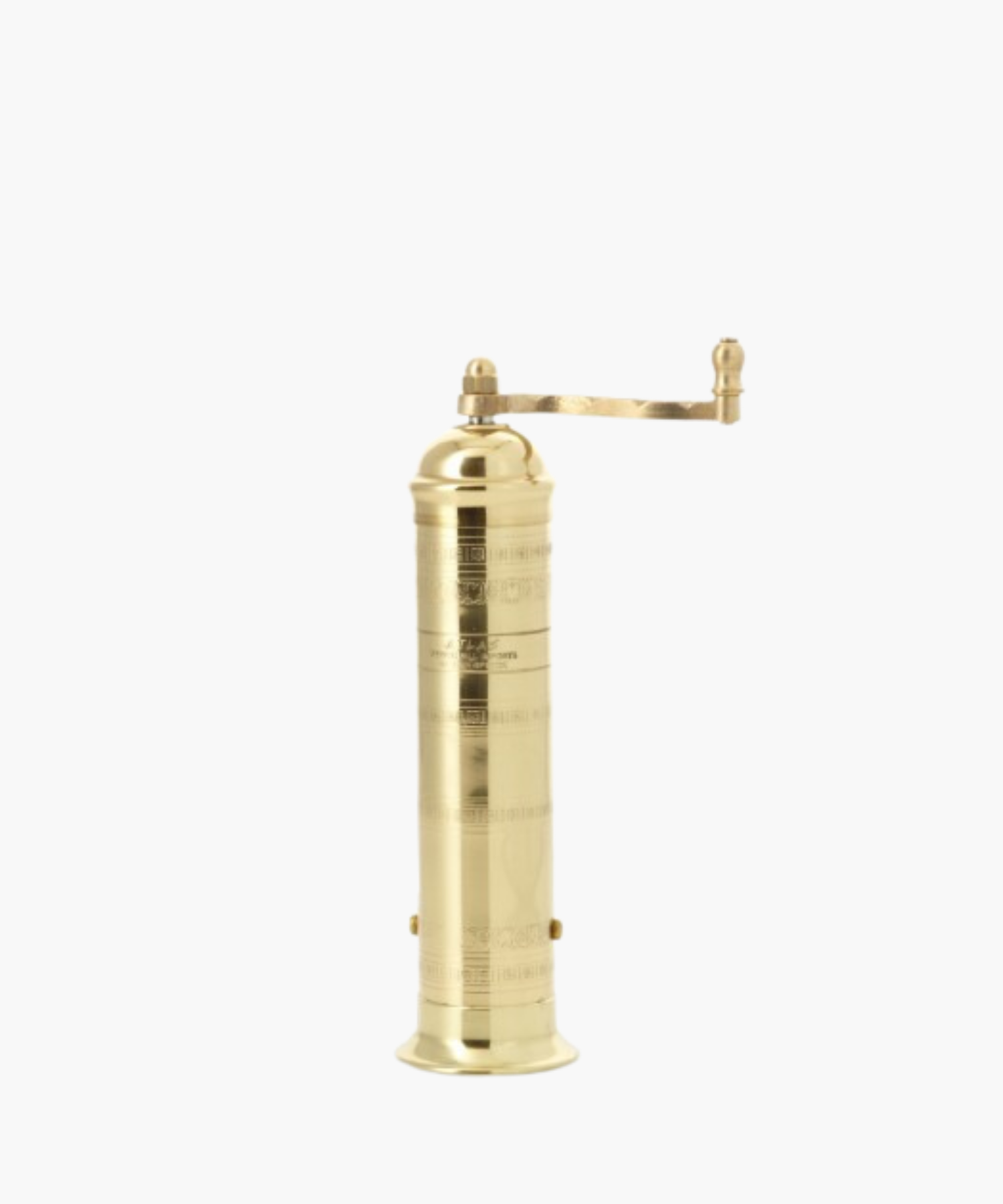 Tall, cylindrical brass pepper mill with a decorative pattern and a side handle, conveying elegance. | Wildwood Home Co.