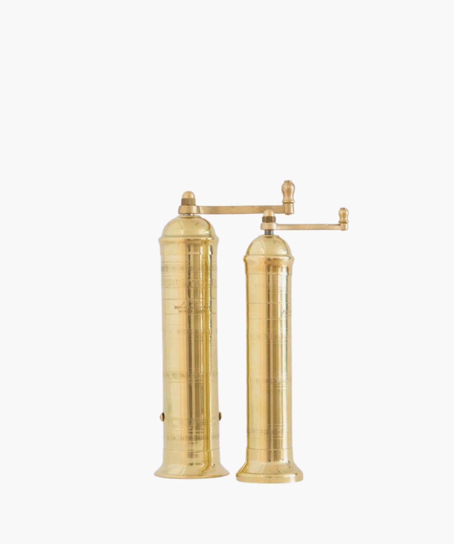 Tall, cylindrical brass pepper mill and salt mill with a decorative pattern and a side handle, conveying elegance. | Wildwood Home Co. | Wildwood Home Co.