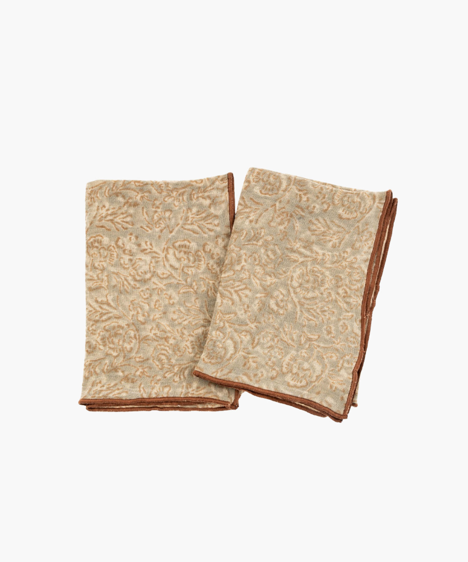 Two folded beige tea towels with a brown floral pattern, trimmed with brown edging. The texture and earthy colors evoke a cozy, elegant feel. | Wildwood Home Co.