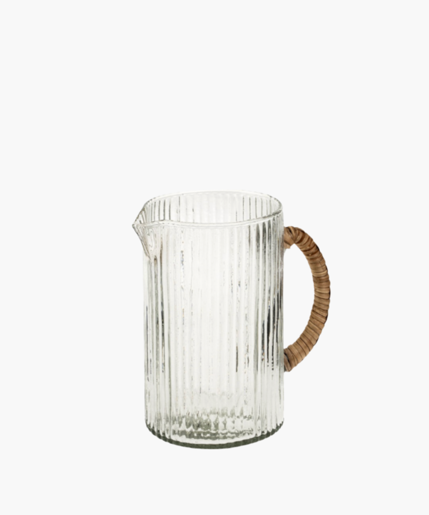 Glass pitcher with vertical ridges, featuring a curved, woven cane handle. The design is simple and elegant, exuding a rustic yet modern charm. | Wildwood Home Co.