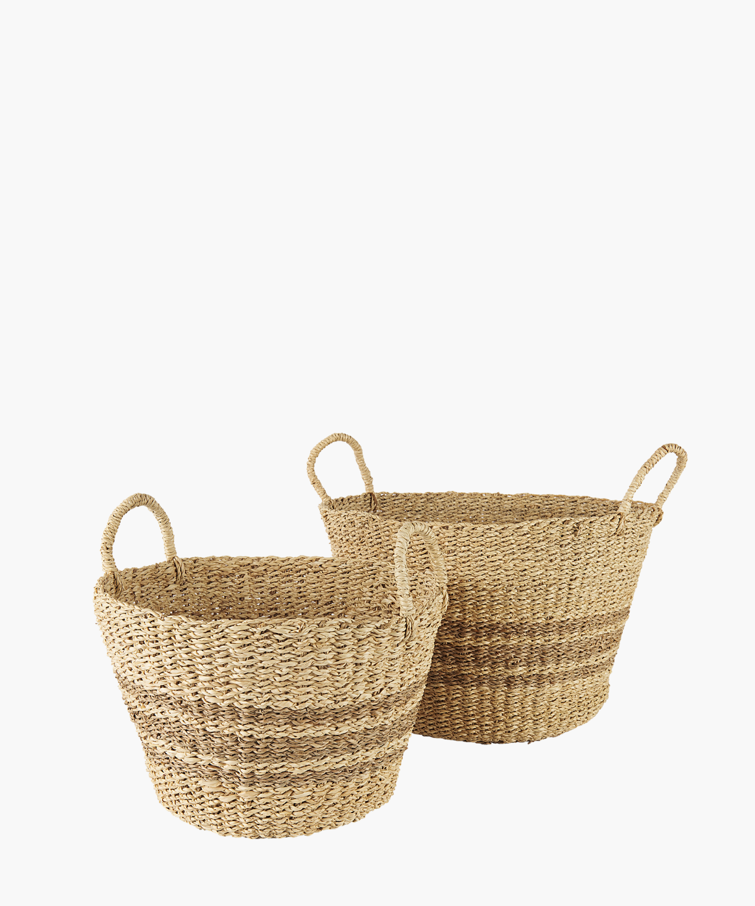 Woven seagrass baskets in a natural and brown tone with two loop handles and subtle striped accents in 2 sizes. The baskets have a simple, rustic design, featuring a slightly flared rim. | Wildwood Home Co.