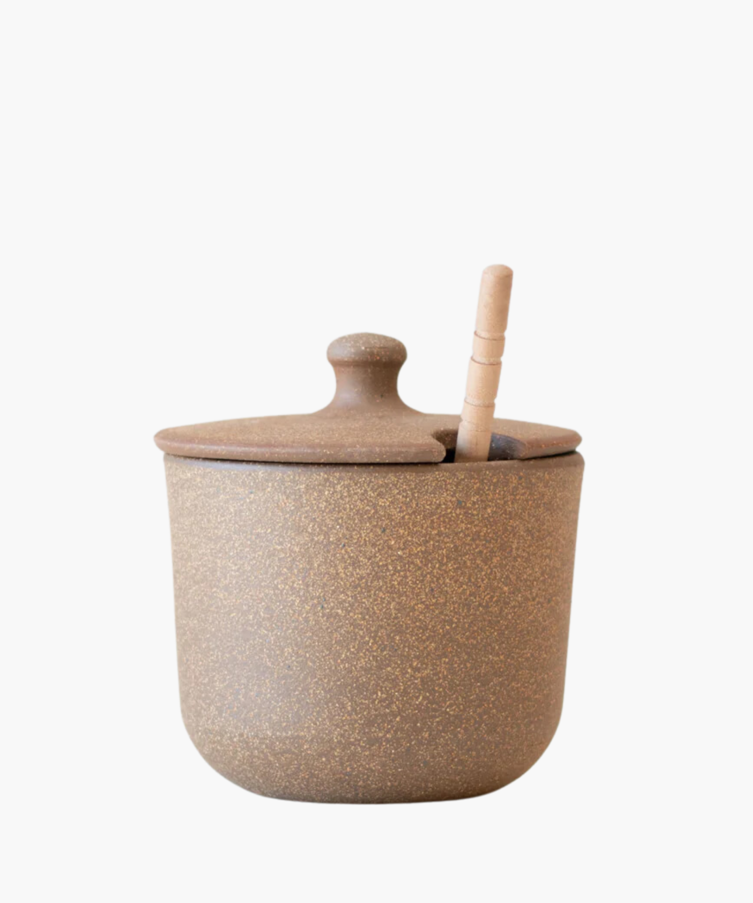 A rustic brown ceramic sugar jar or honey pot with a speckled texture and a lid, featuring a subtle slot for a wooden spoon, conveying a cozy, earthy vibe. | Wildwood Home Co.