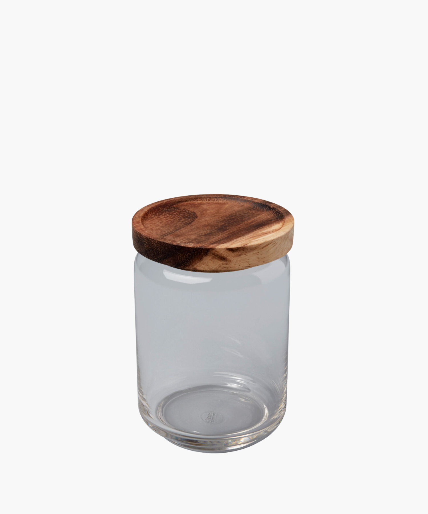 A clear glass jar with a round, smooth wooden lid sits against a white background. The simple, functional design conveys a minimalist aesthetic. | Wildwood Home Co.