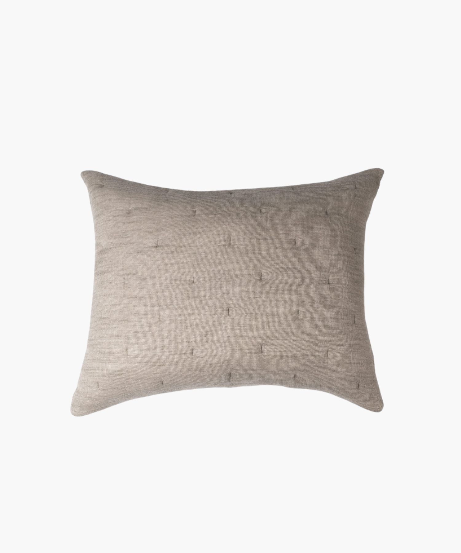 Rectangular beige textured pillow on a white background highlighting fabric texture, stitching, and finish. | Wildwood Home Co.