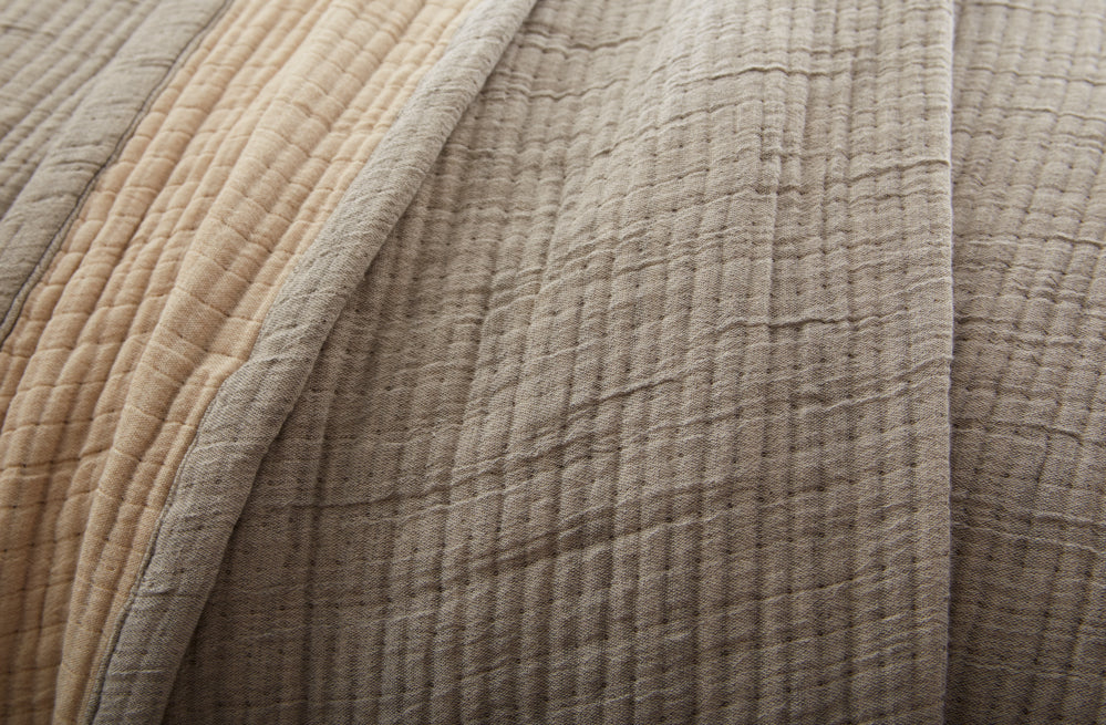 Close-up of textured greyish brown fabric with a focus on color and texture. | Wildwood Home Co.