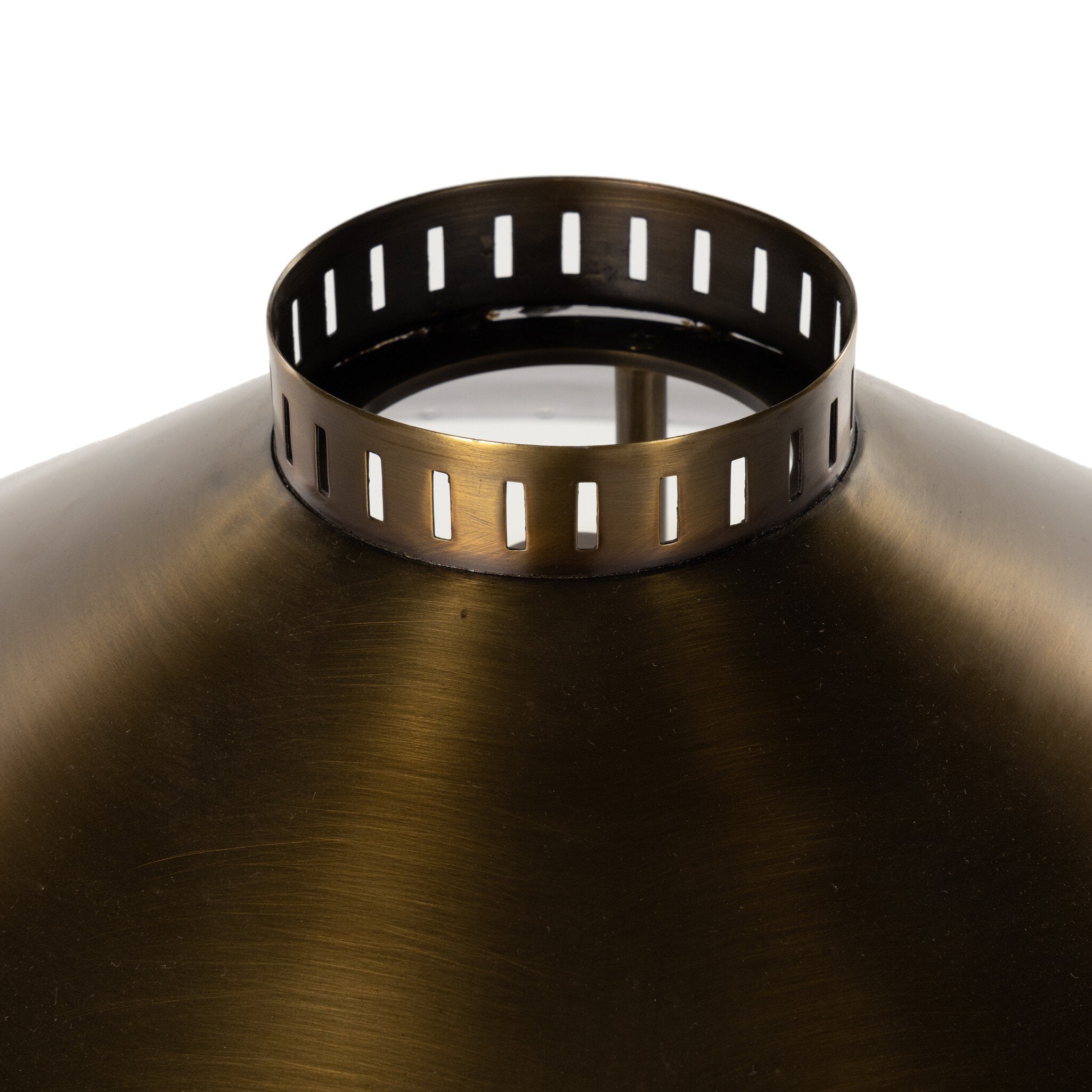 Close up of the tall floor lamp with a antique brass shade on a white background.