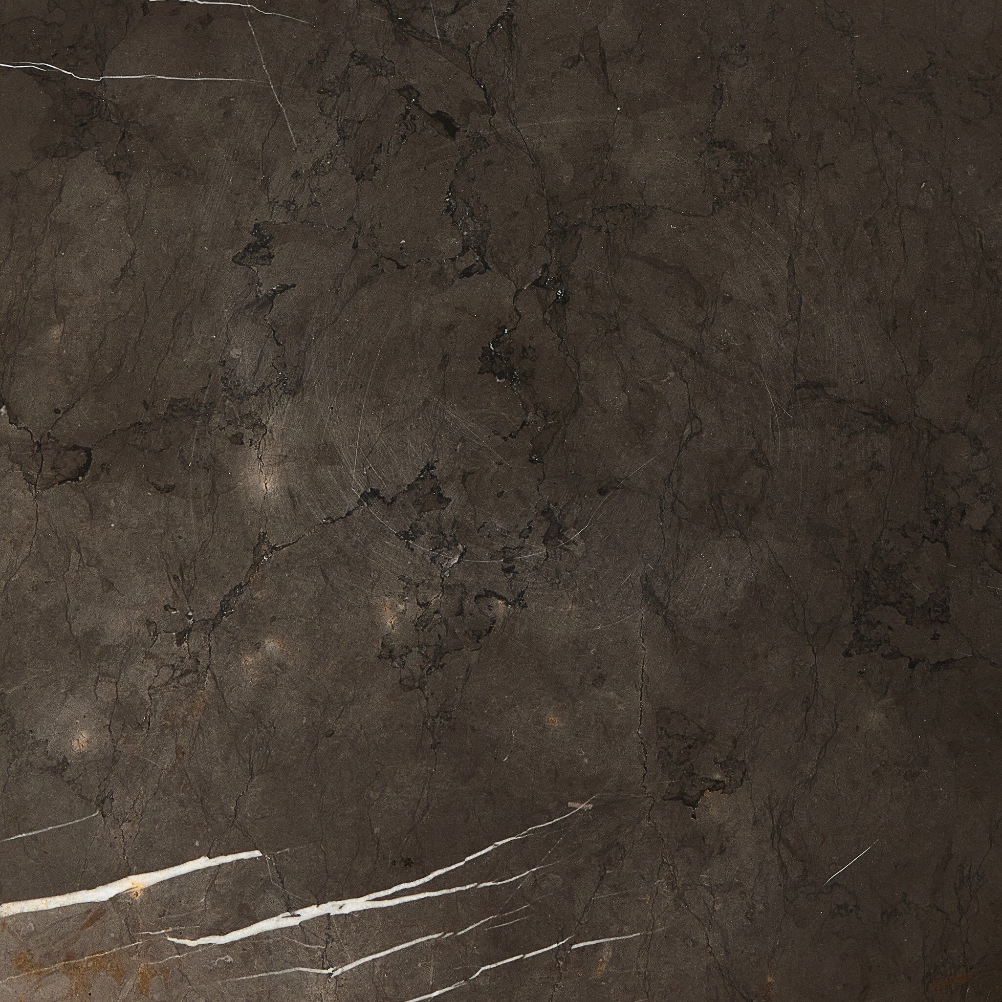 Close-up of the grey Italian marble end table showing its dark color and veining. 