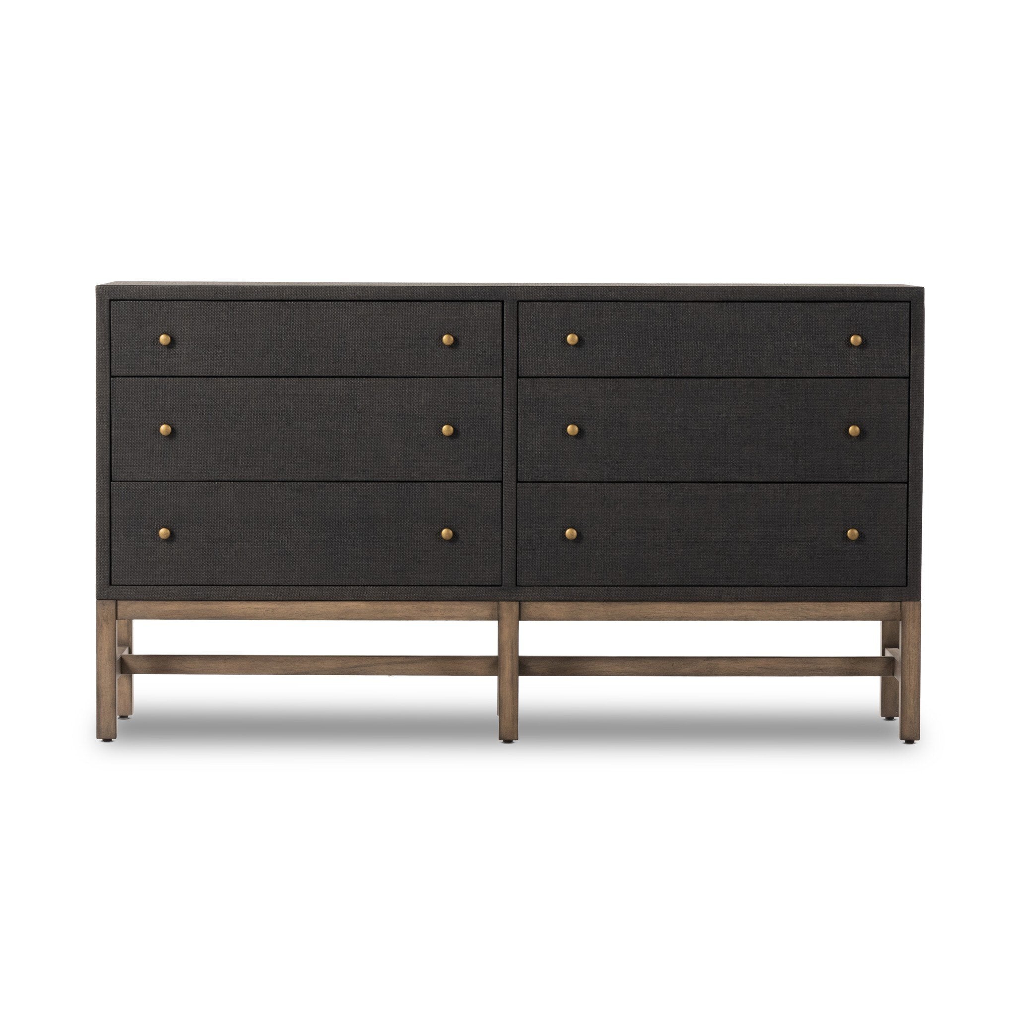 Black dresser with brass knobs and wooden legs on a white background. | Wildwood Home Co.