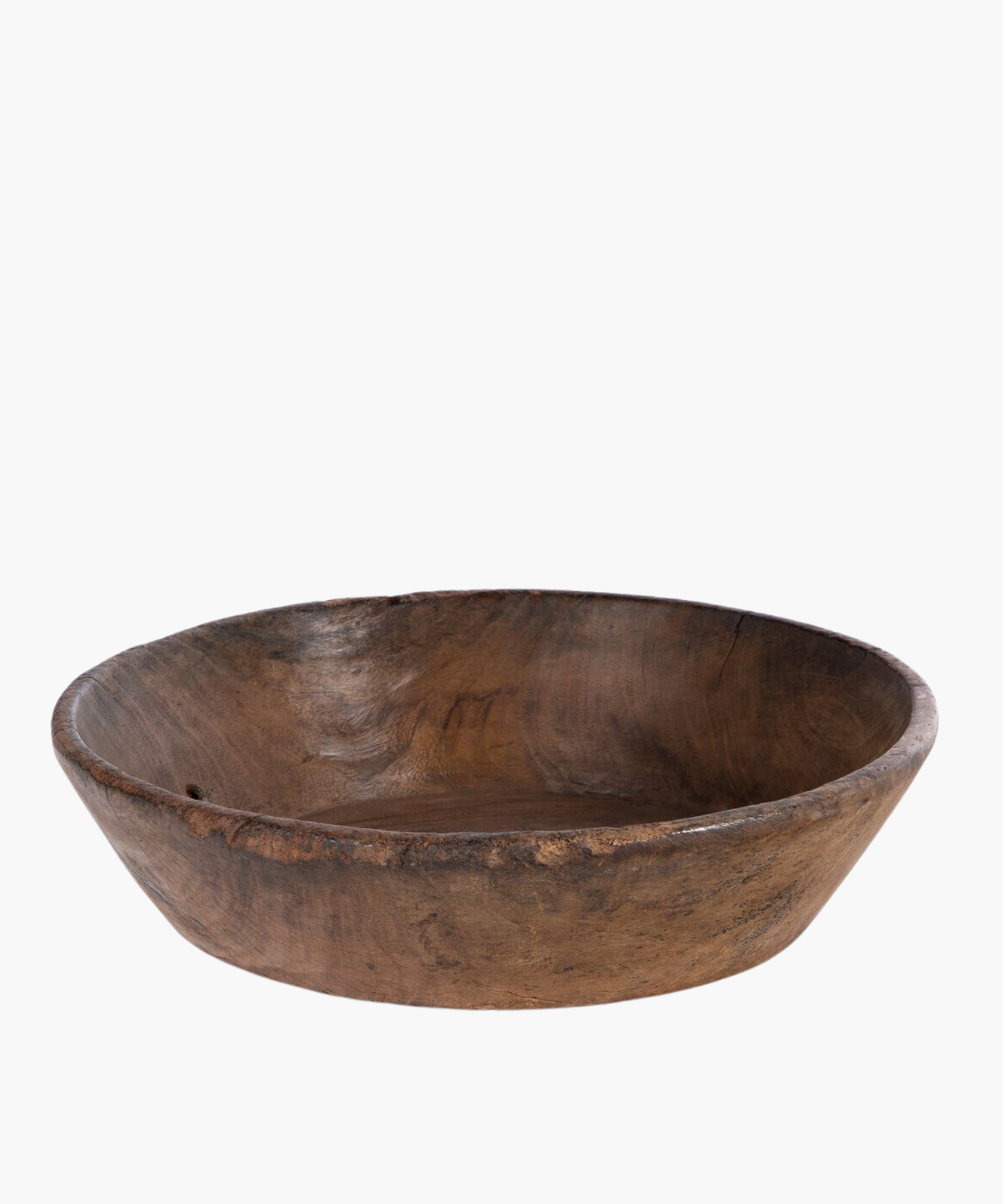 Large rustic wooden bowl with a smooth, rounded interior and rough, textured exterior. The natural grain and earthy tones suggest simplicity and warmth. | Wildwood Home Co.