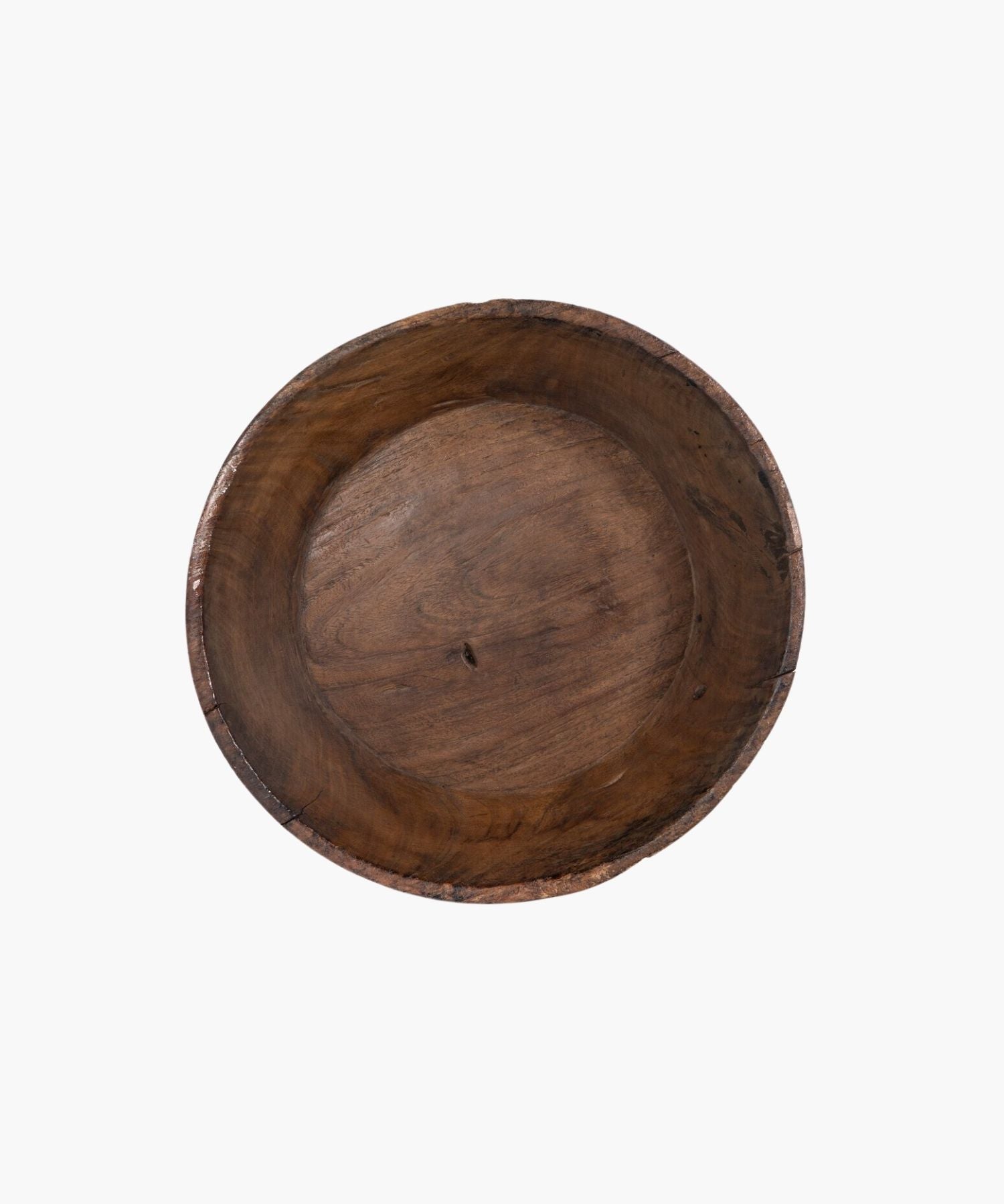 Overhead view of a large rustic wooden bowl with a smooth, rounded interior and rough, textured exterior. The natural grain and earthy tones suggest simplicity and warmth. | Wildwood Home Co.