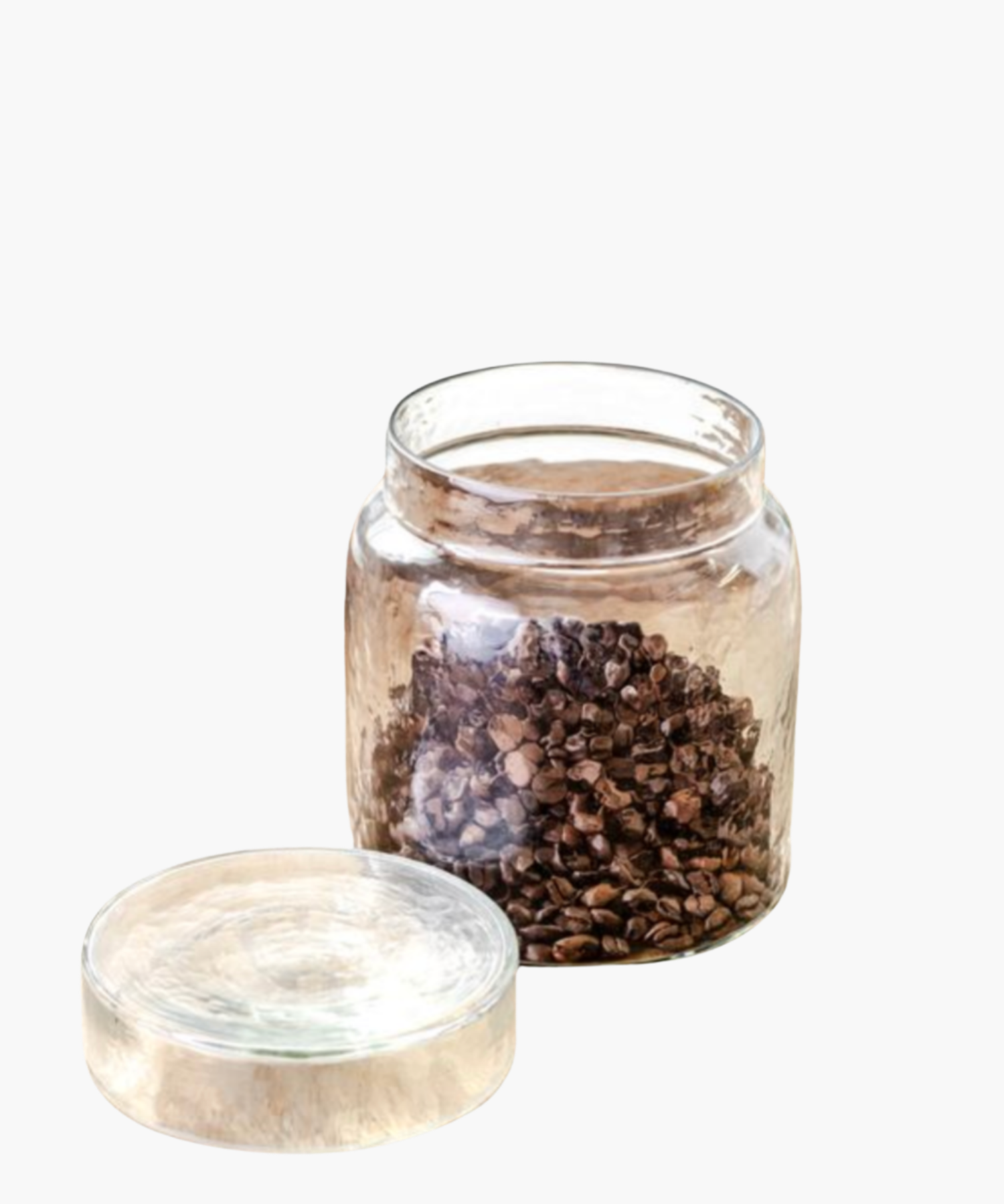 A clear glass jar filled with coffee beans against a white background. The scene conveys simplicity and vintage charm. | Wildwood Home Co.