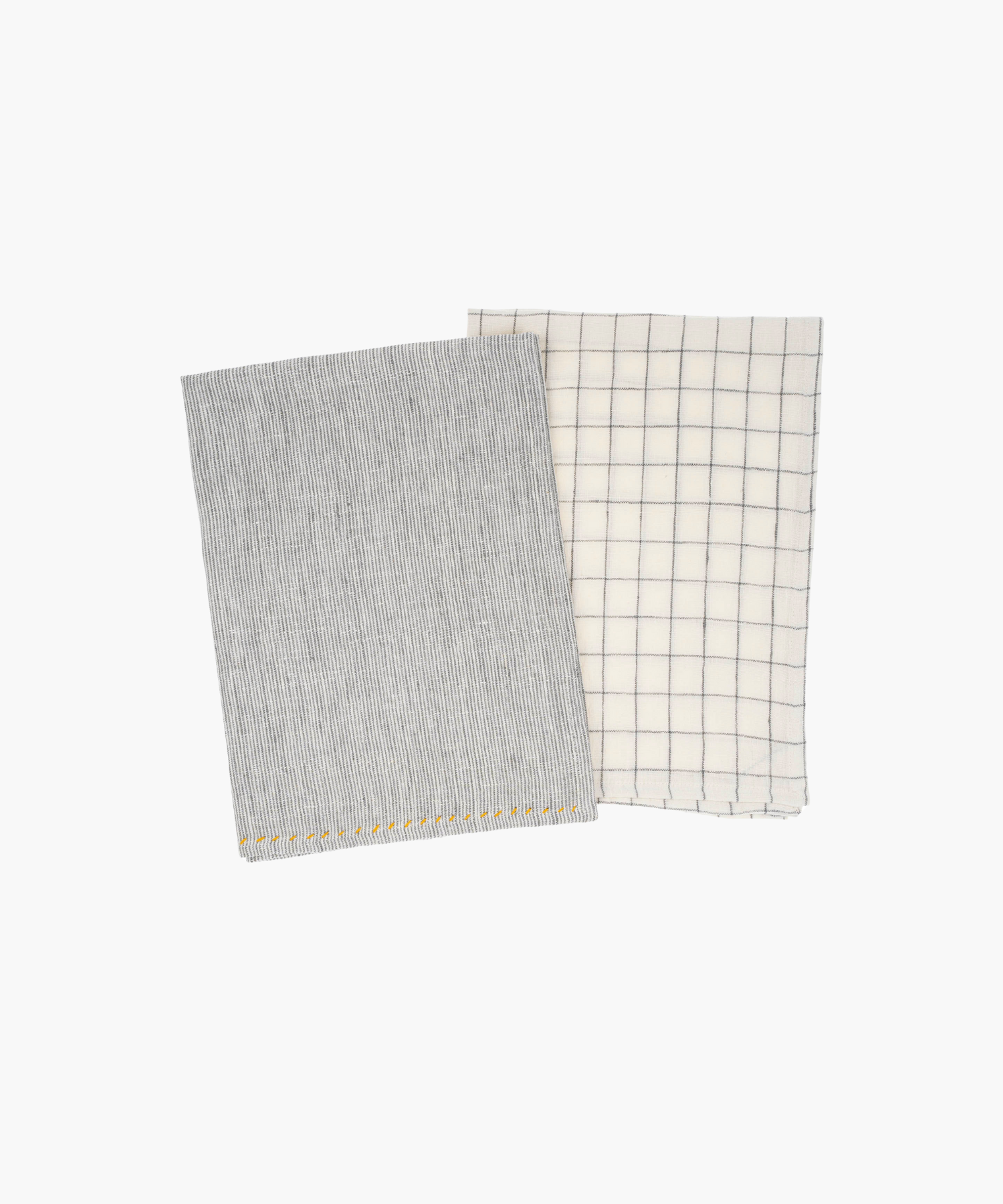 Two folded linen kitchen tea towels: one grey with subtle stripes, and the other white with a blue grid pattern. Simple and tidy appearance. | Wildwood Home Co.