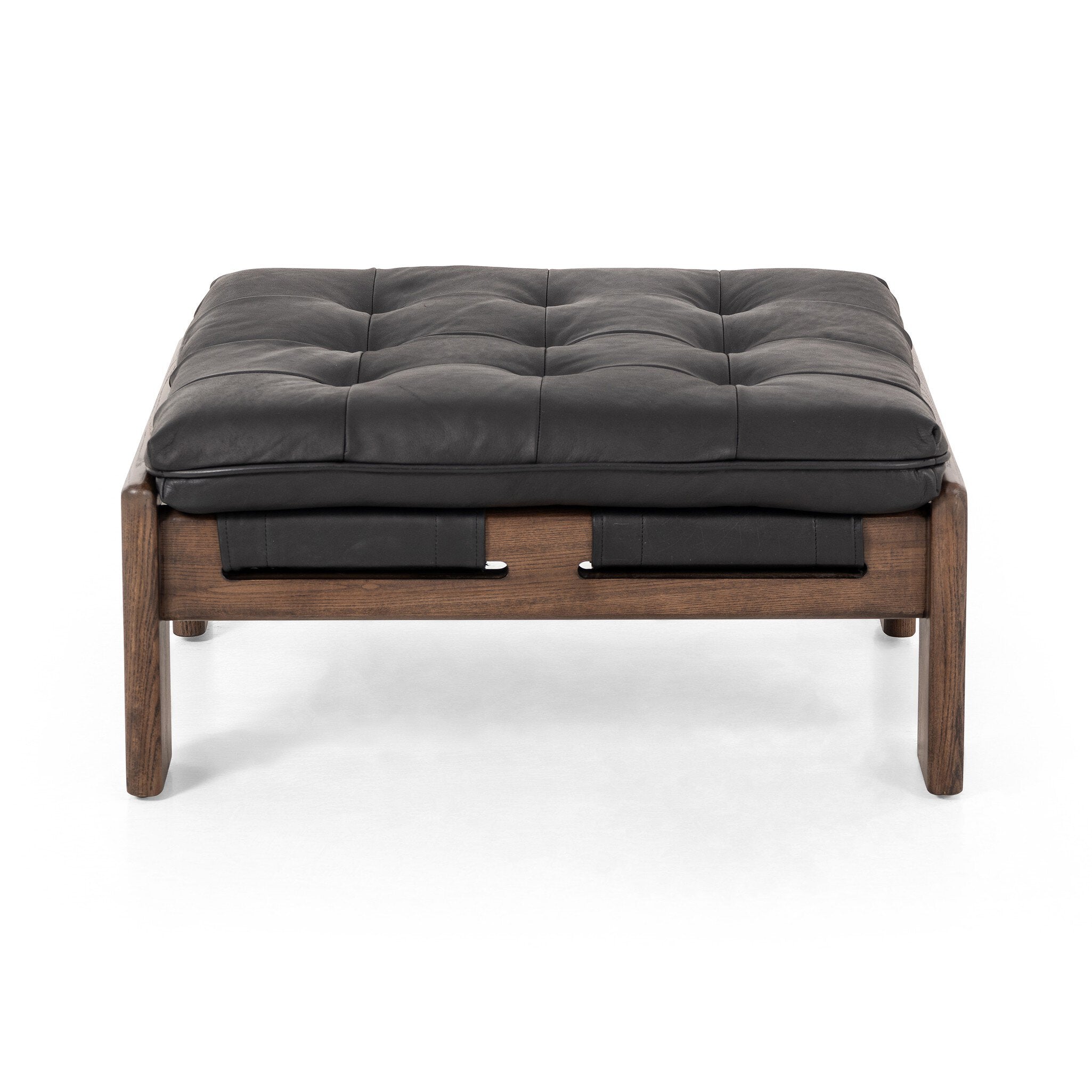 Black leather cushioned ottoman with wooden frame on a white background. | Wildwood Home Co.