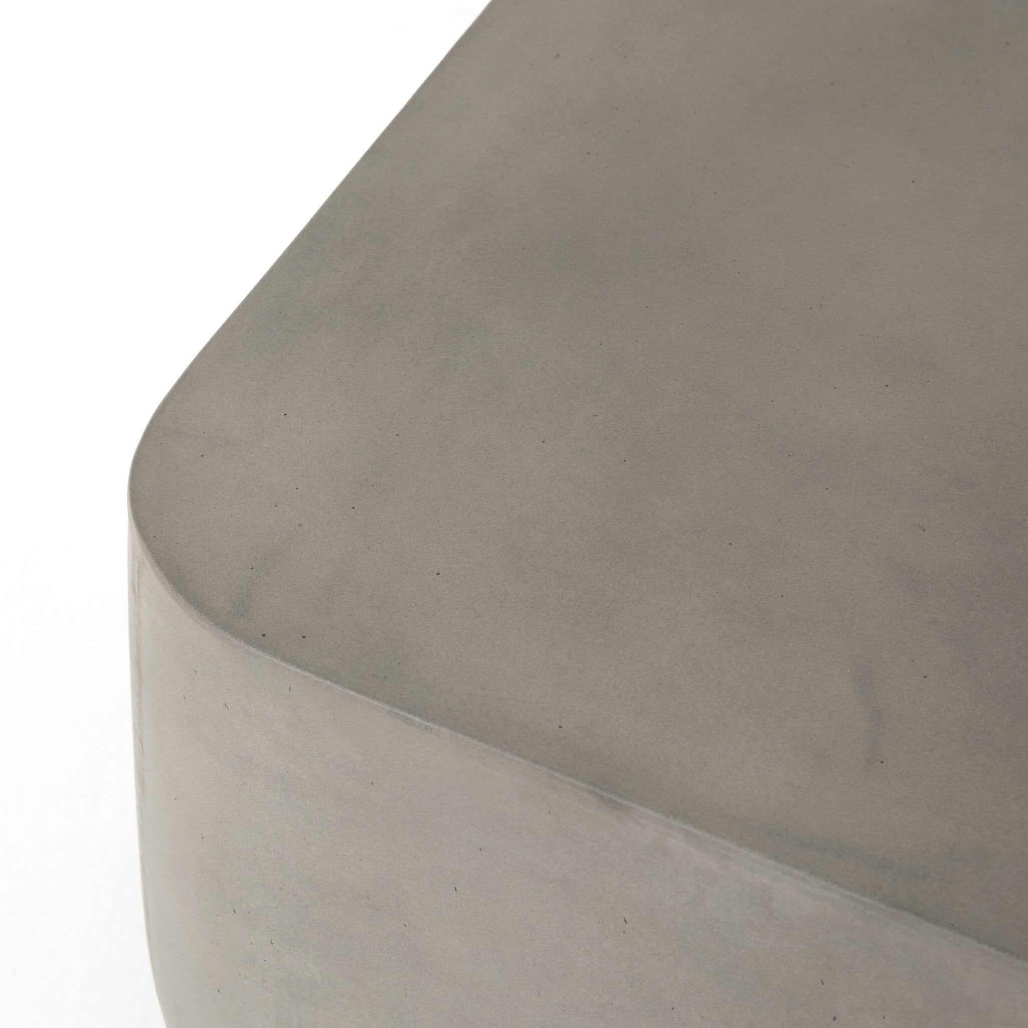 Grey-finished concrete and soft square shaped end table on a white background. 