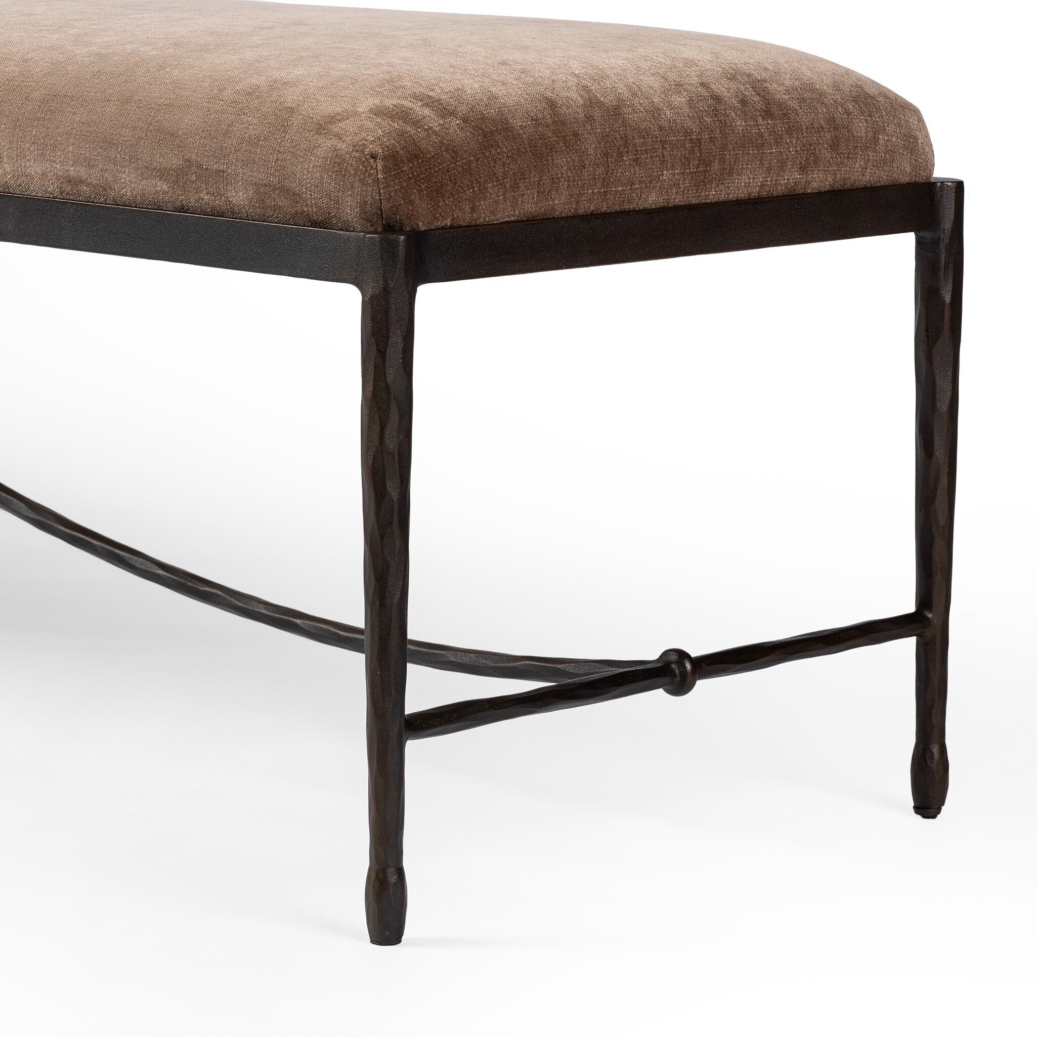 Brown upholstered bench with black metal frame on a white background.