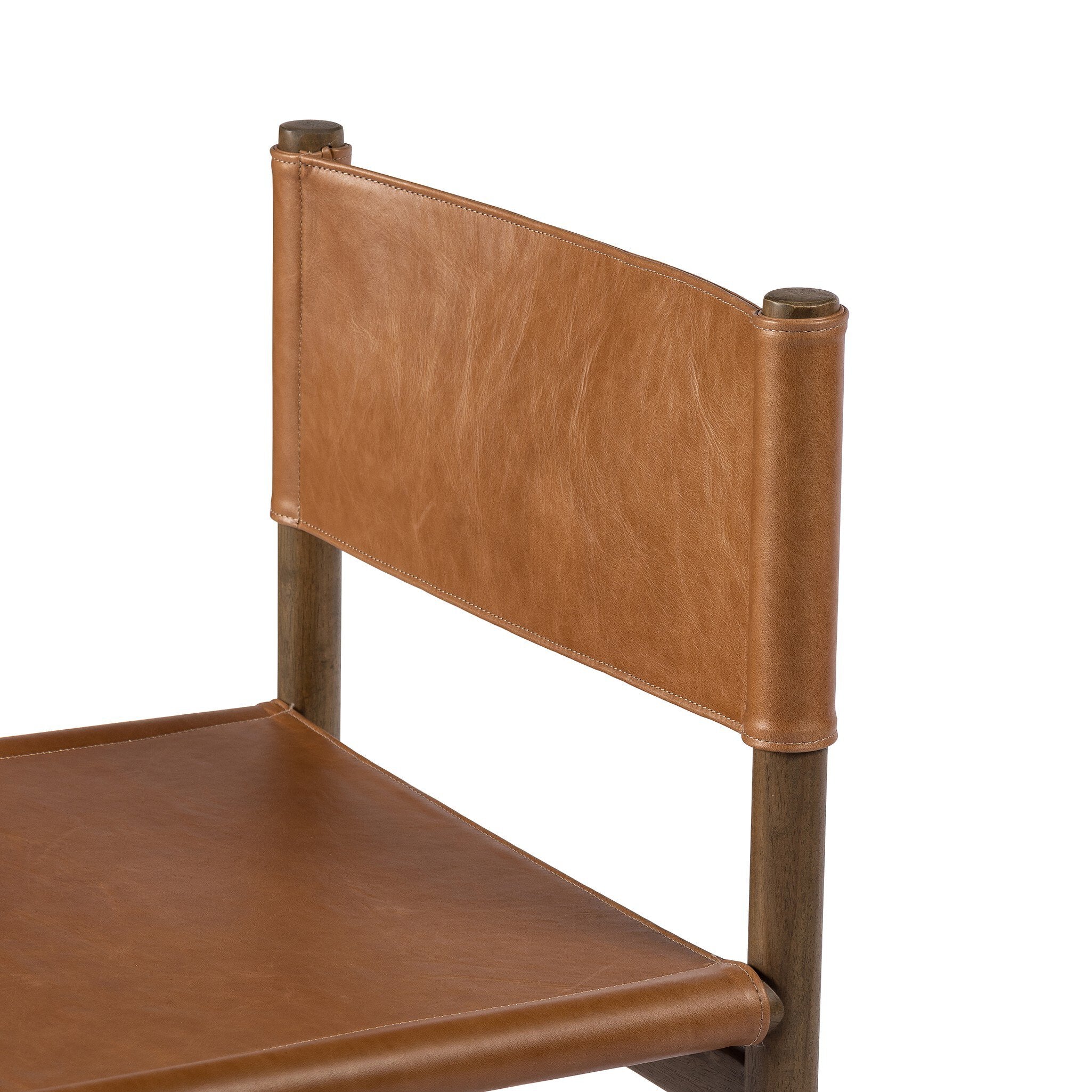 Brown wooden chair with sling-style leather seating on a white background.
