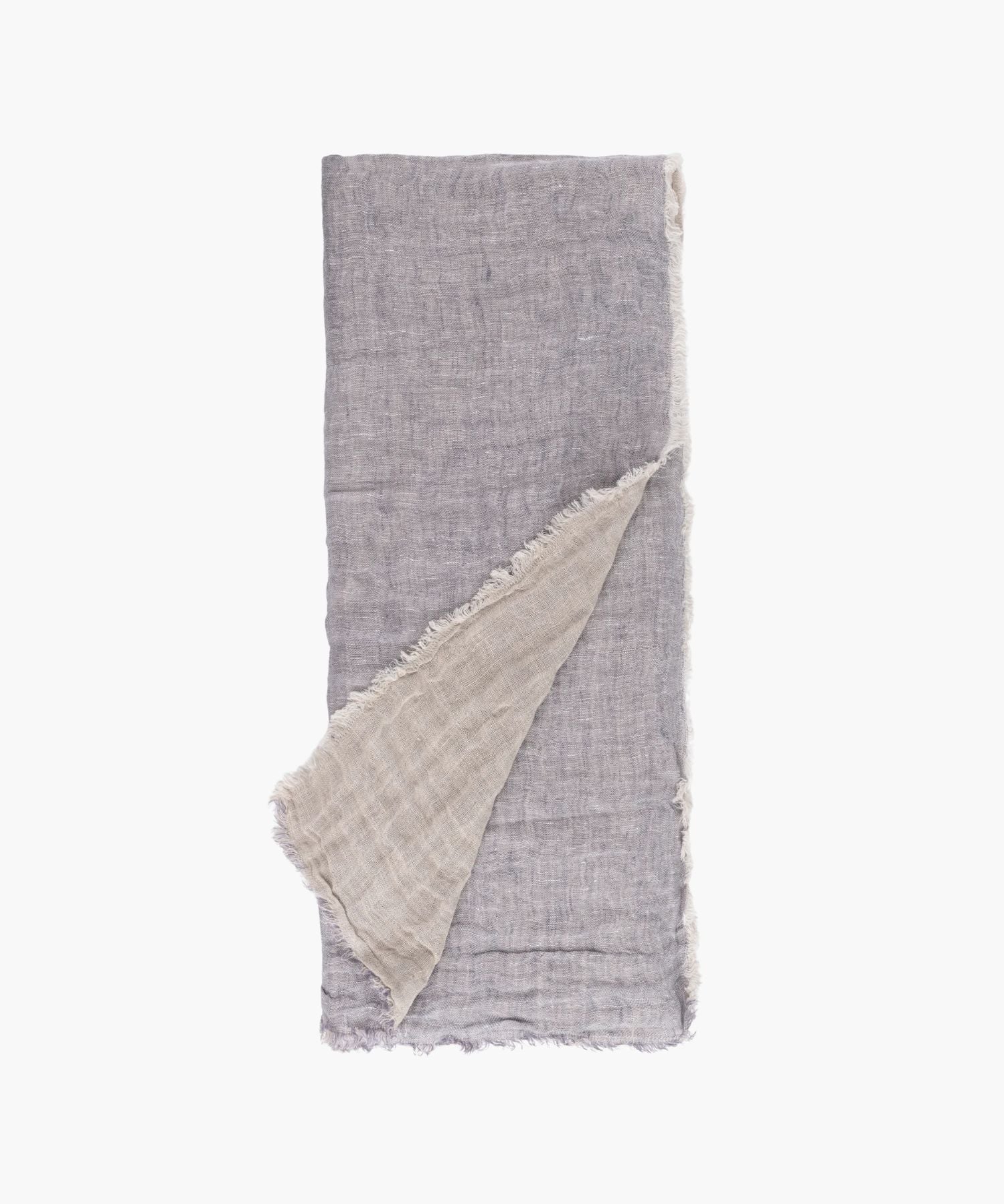 Flat lay of the Kent Super Throw in natural light blue linen tone, highlighting its oversized linen gauze texture and soft fringed edges.