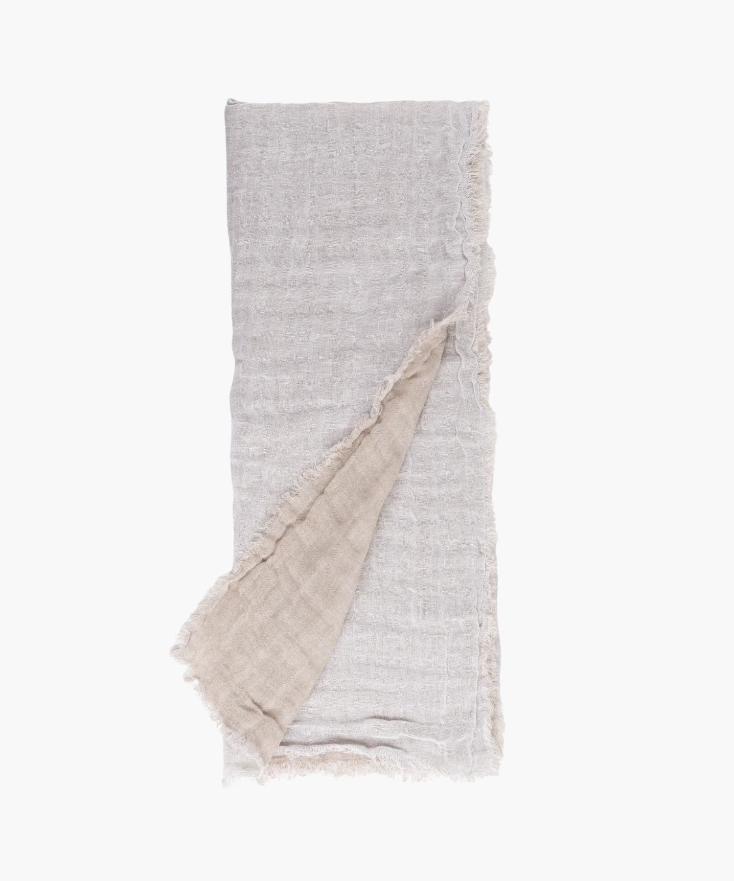 Flat lay of the Kent Super Throw in natural white linen tone, highlighting its oversized linen gauze texture and soft fringed edges. | Wildwood Home Co.
