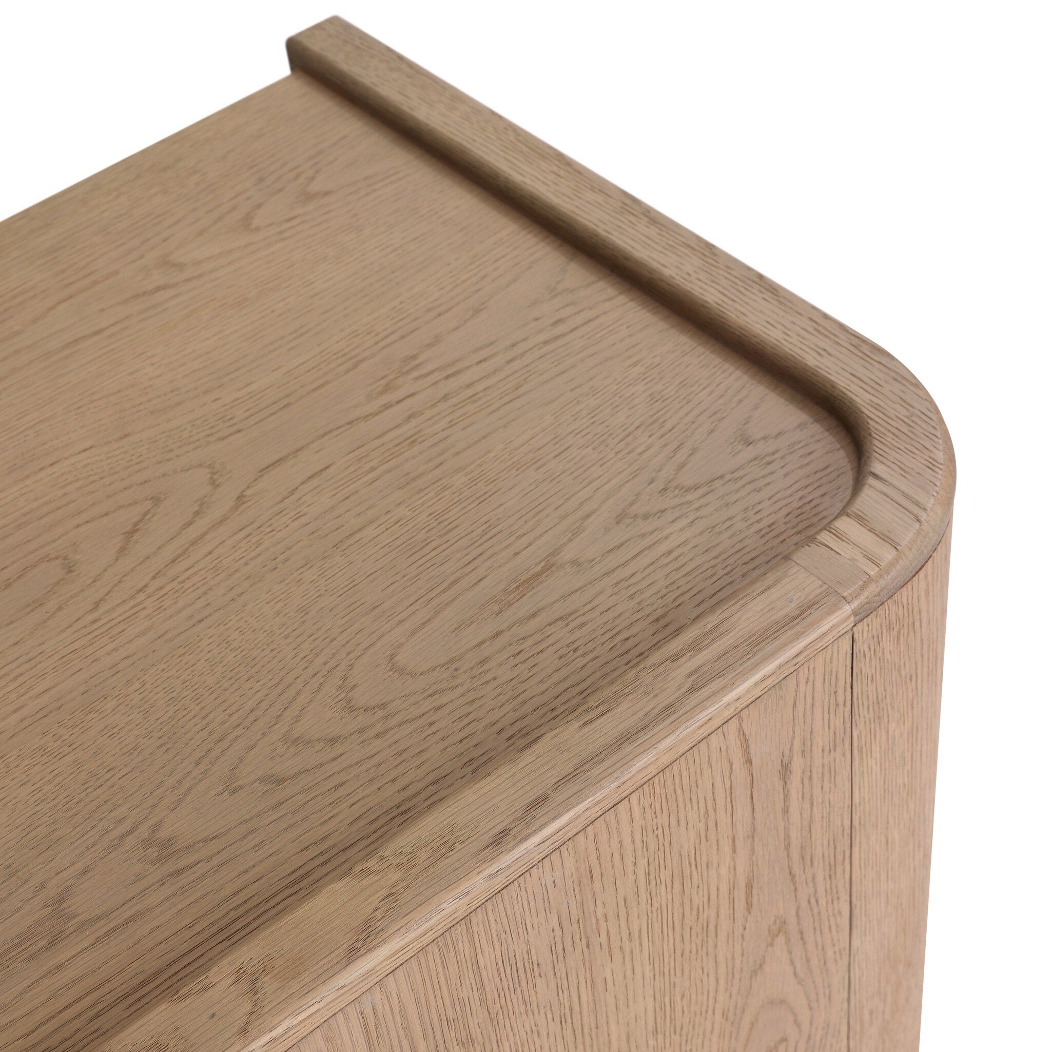 Close up of a small cabinet style nightstand with two doors and split circle hardware on a white background.