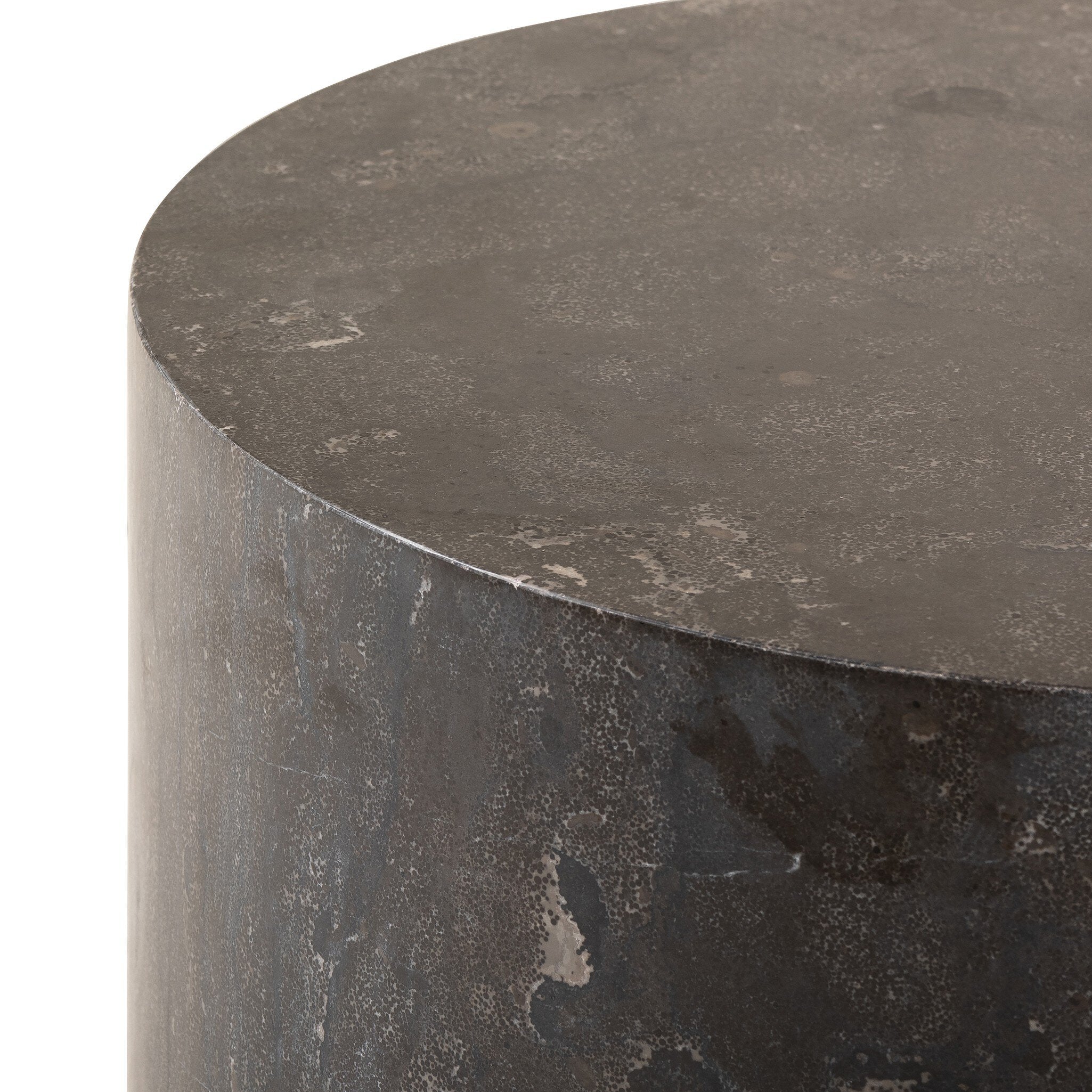 Cylinder-shaped bluestone end table with a textured surface on a white background.