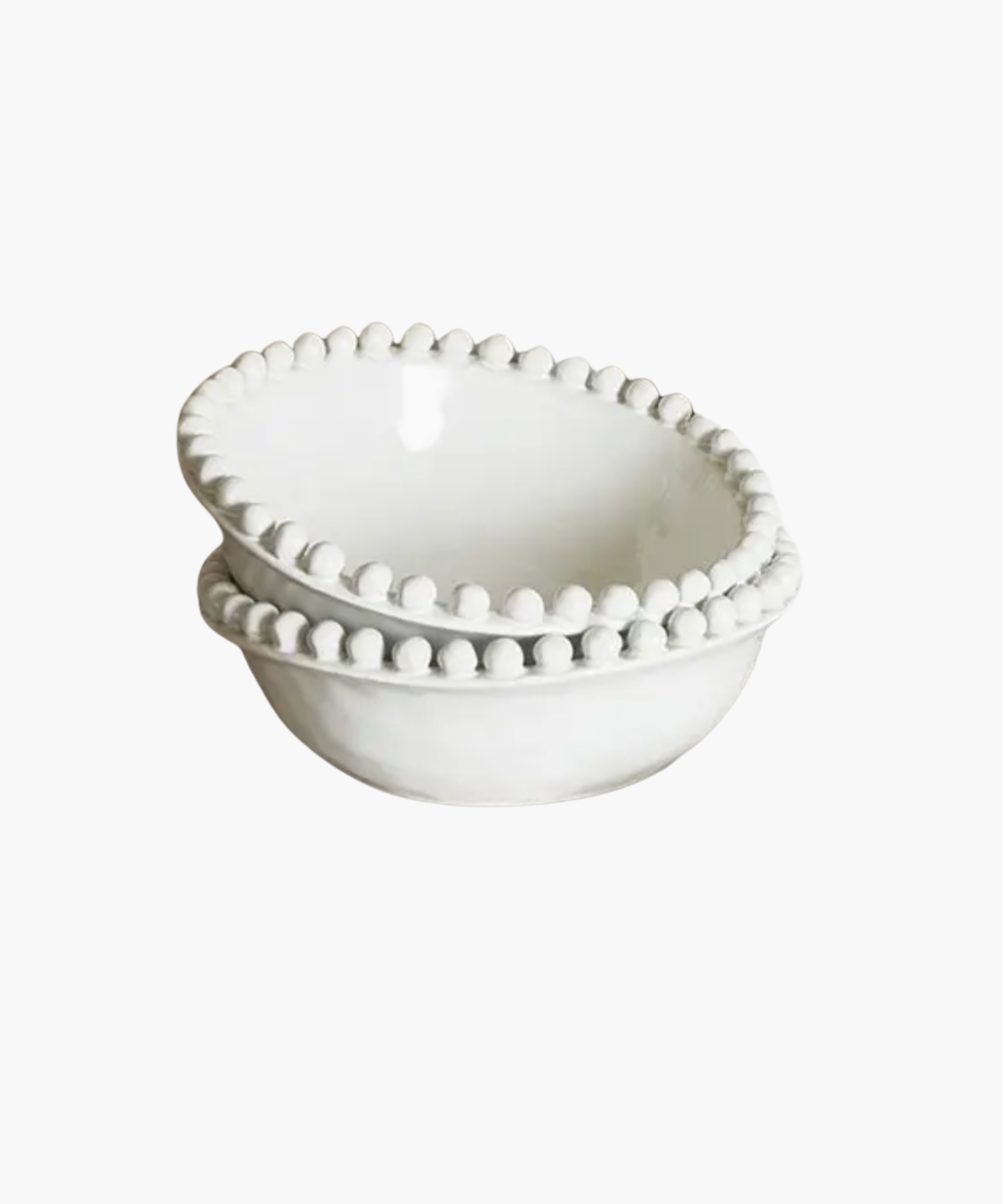 Two white ceramic bowls stacked, each with a raised dot pattern around the rim. The design is simple and elegant, conveying a clean, modern aesthetic. | Wildwood Home Co.