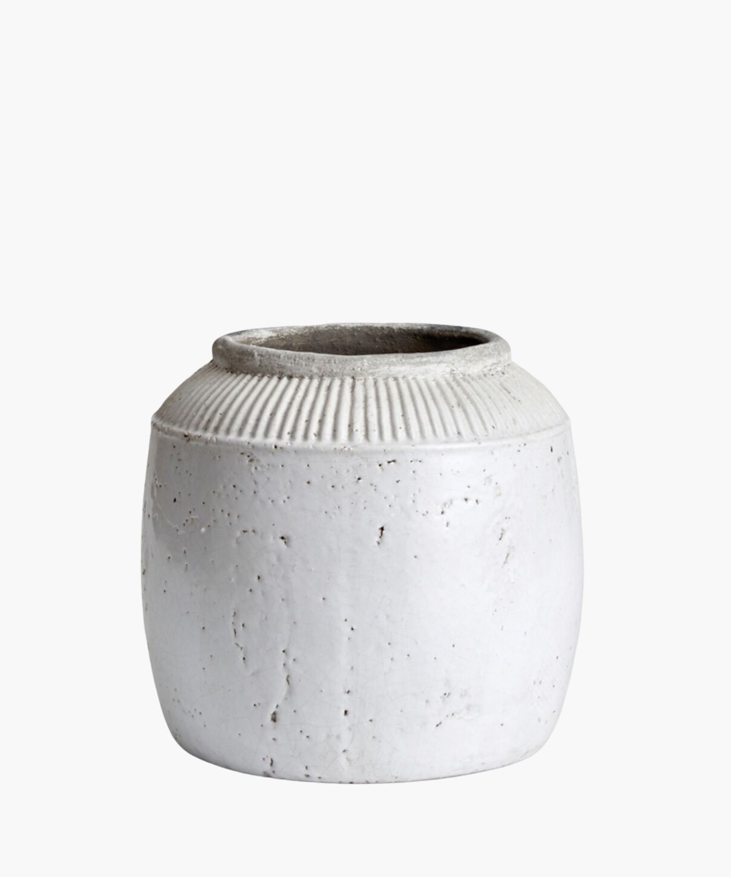 A large textured white ceramic pot with a round body and a narrow opening. The pot has subtle vertical ridges near the top. | Wildwood Home Co.