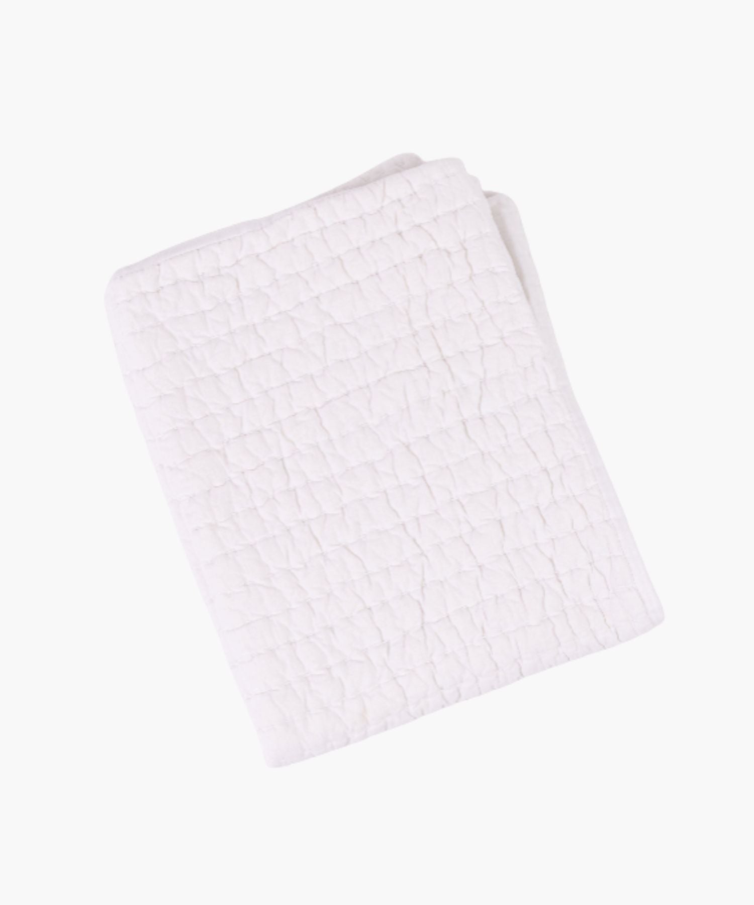 Flat lay of the Maegan Quilt in white, showing its hand-quilted Kantha-style stitching in a grid pattern and lightweight voile texture. | Wildwood Home Co.