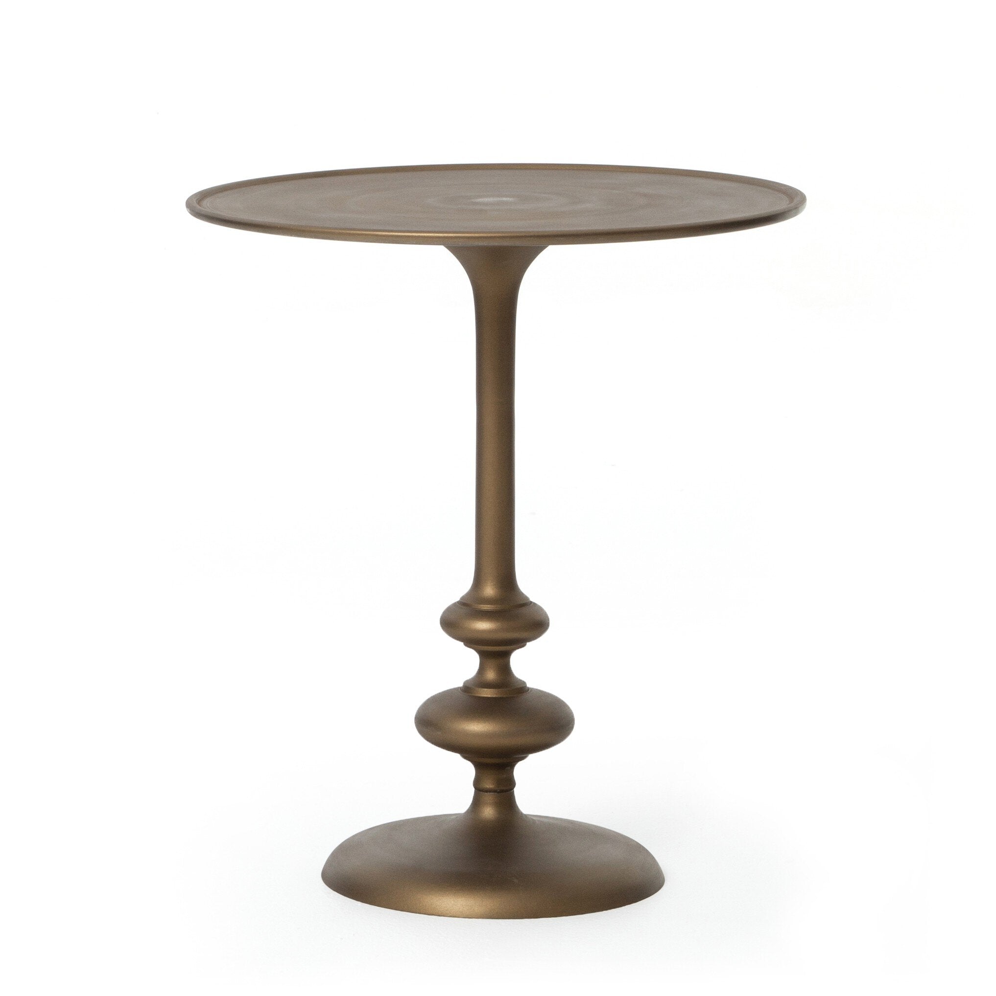 Brass finished pedestal table on a white background. | Wildwood Home Co.