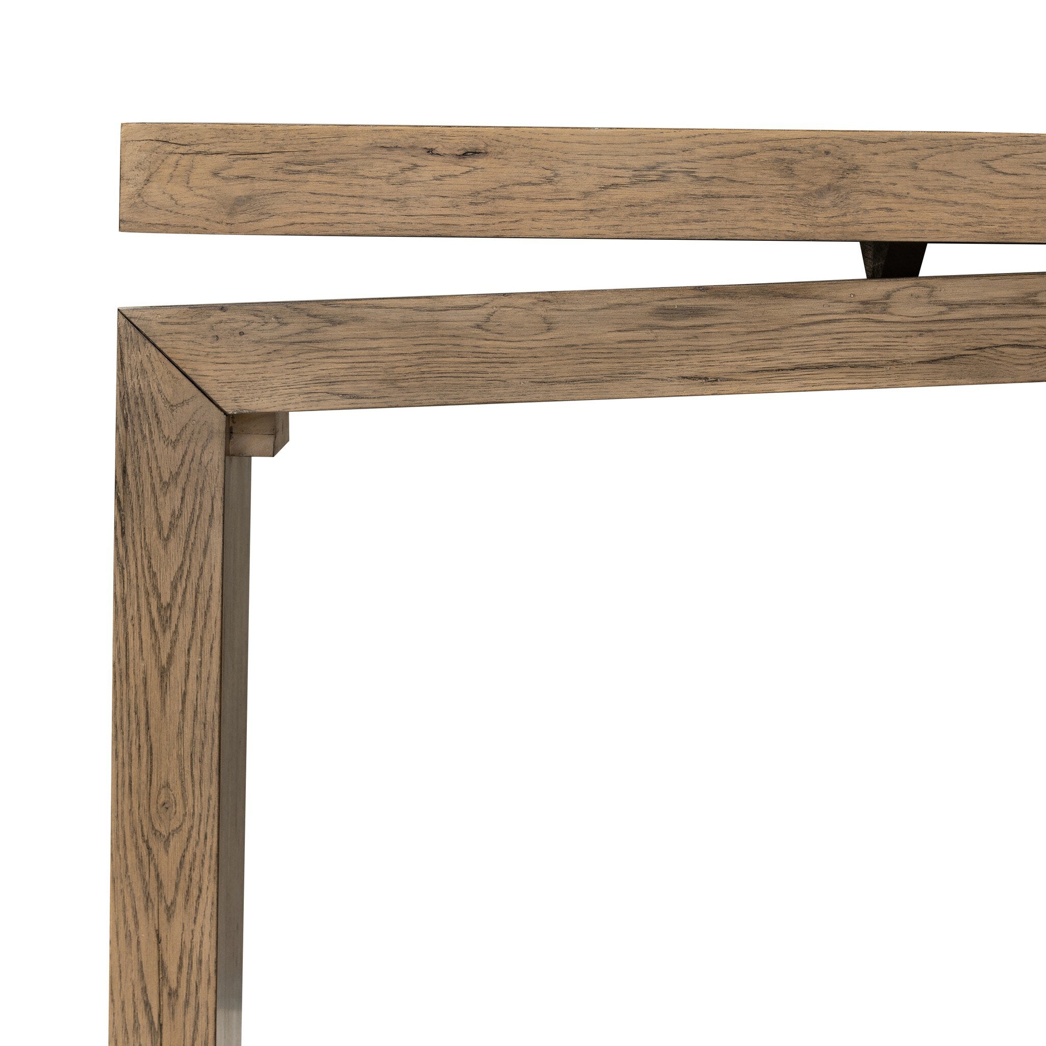 Close up of a wooden console table with a curved design on a white background.