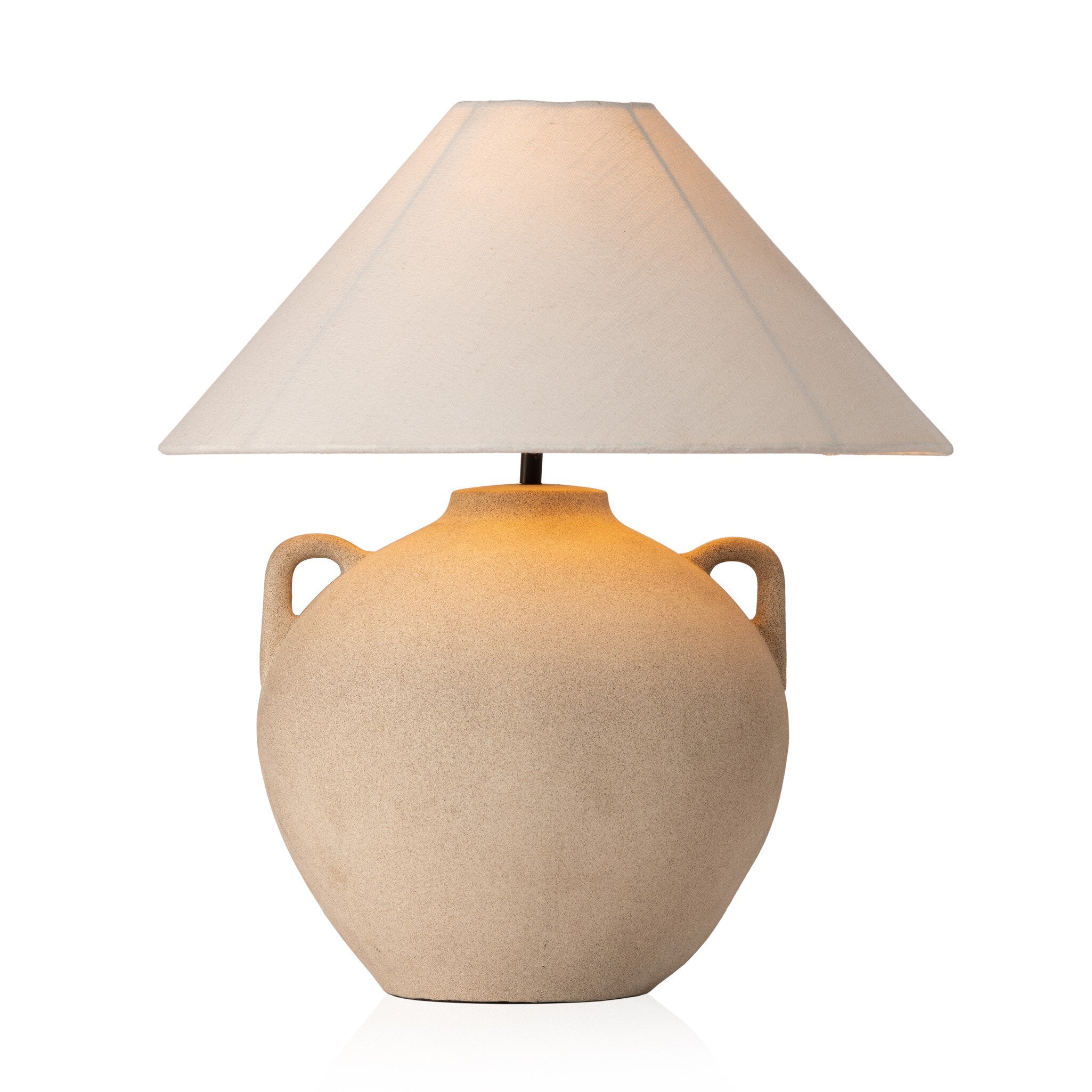 Beige ceramic table lamp with an ivory lampshade on a white background.