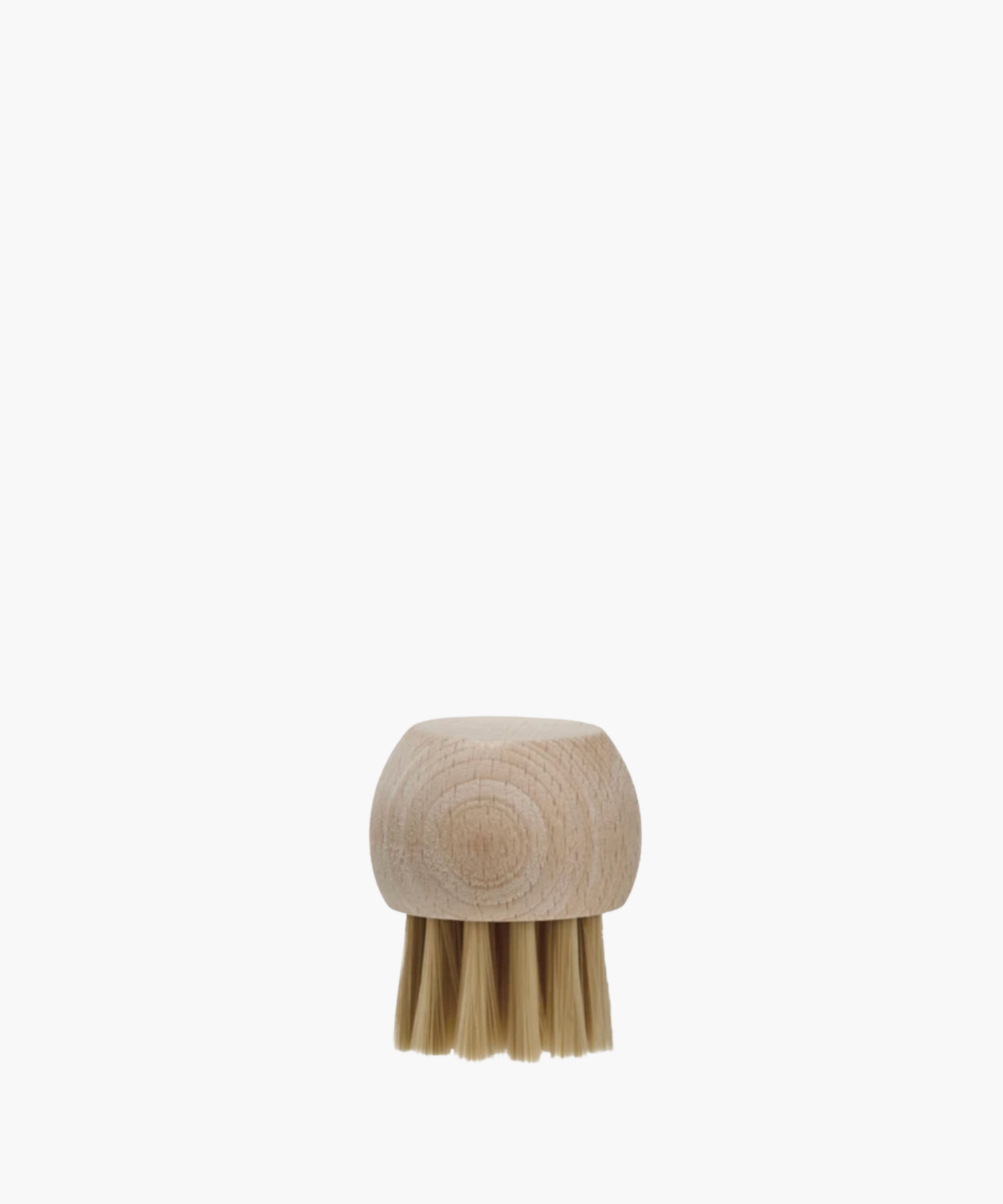 Wooden vegetable brush with a round, smooth handle and stiff, short bristles. The minimalist design conveys simplicity and functionality.