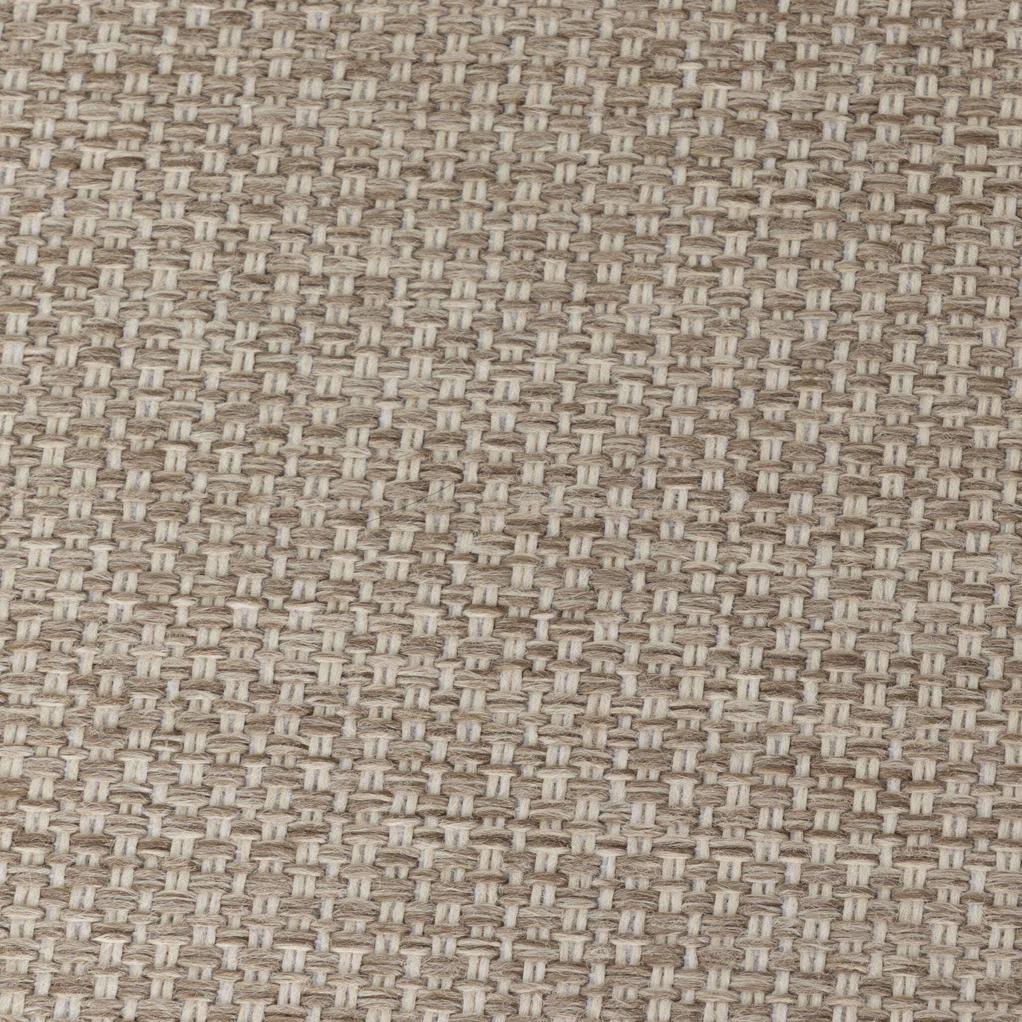 Close up of the upholstered cushions from the outdoor chair showing its color and fabric texture. 