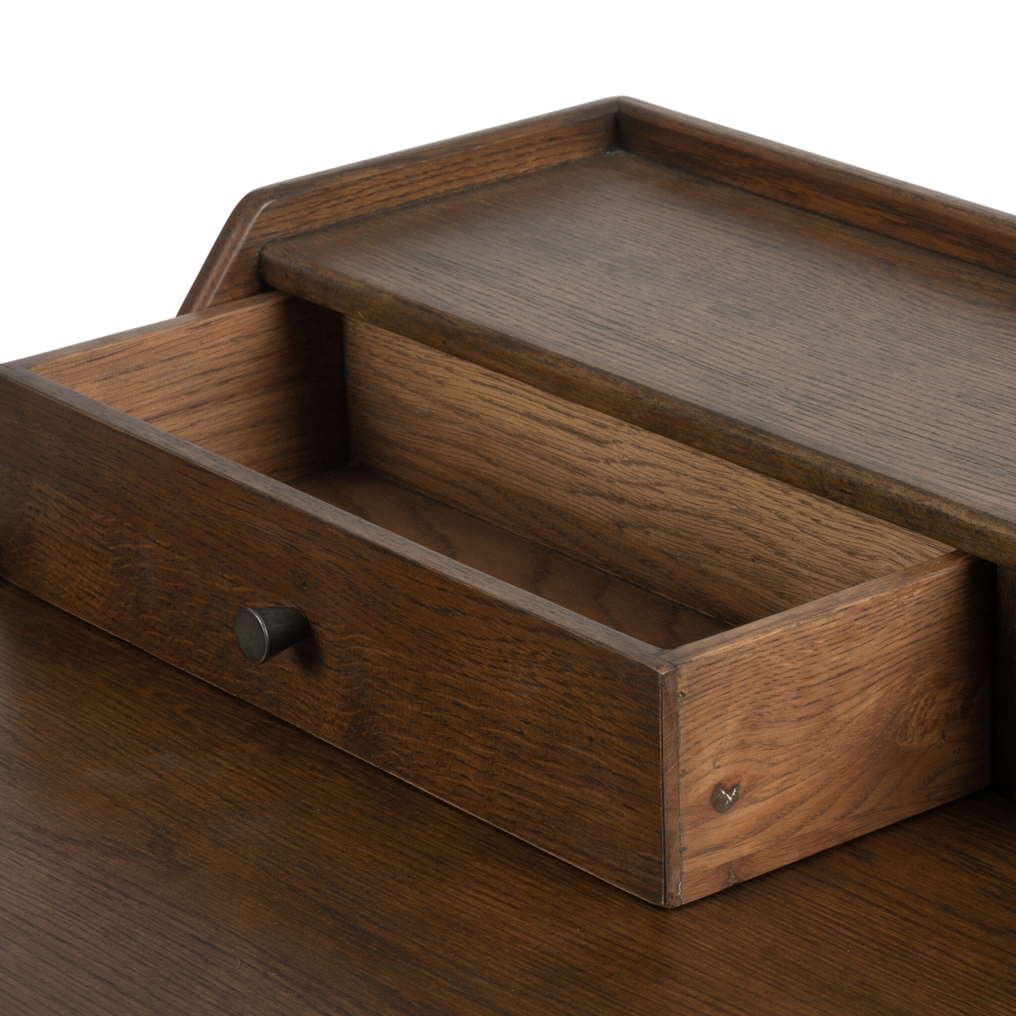 Close up of a wooden desk with drawers on a white background.